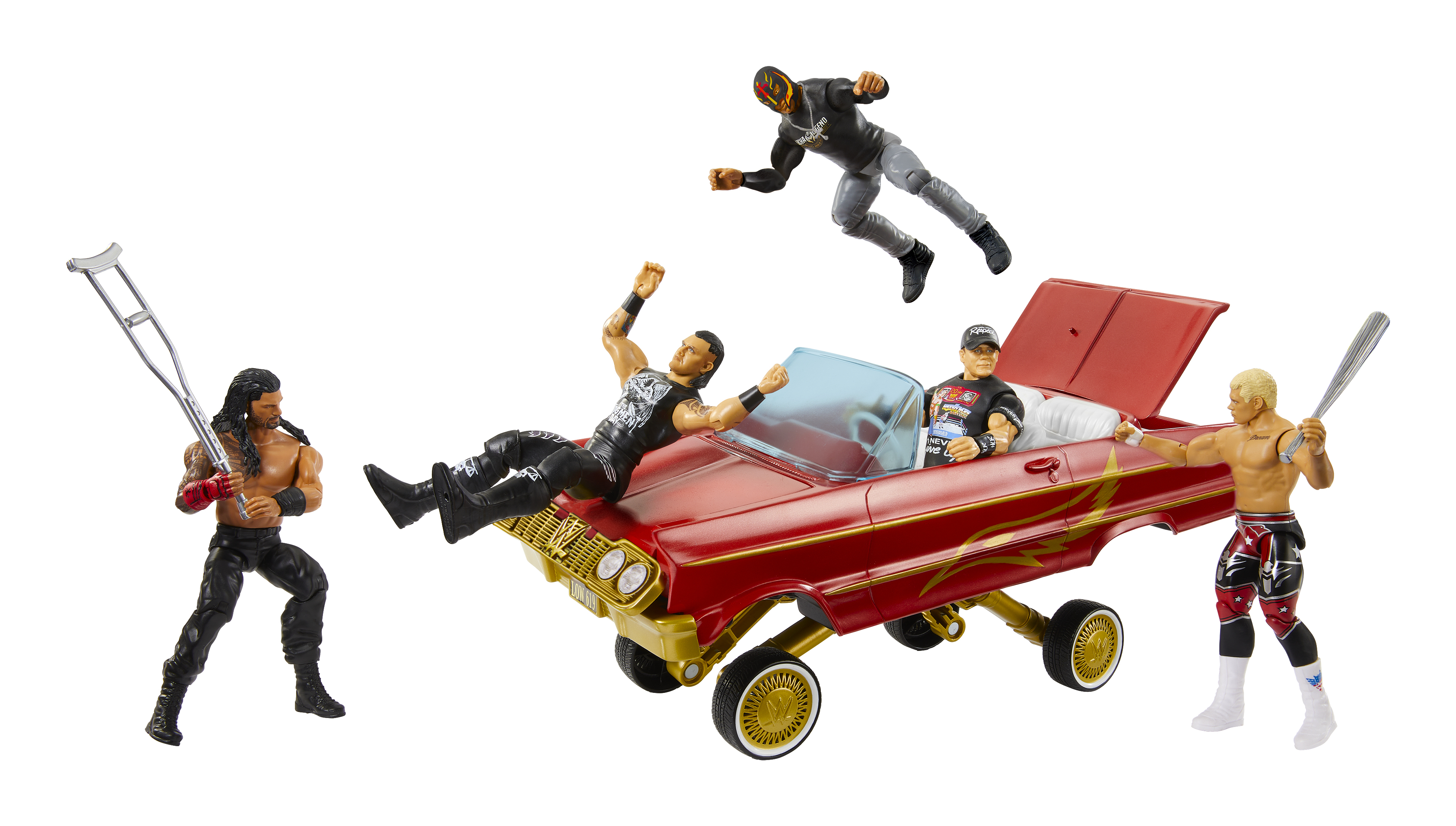 Figure di wrestler in un'auto, un wrestler salta. Uno con una mazza.