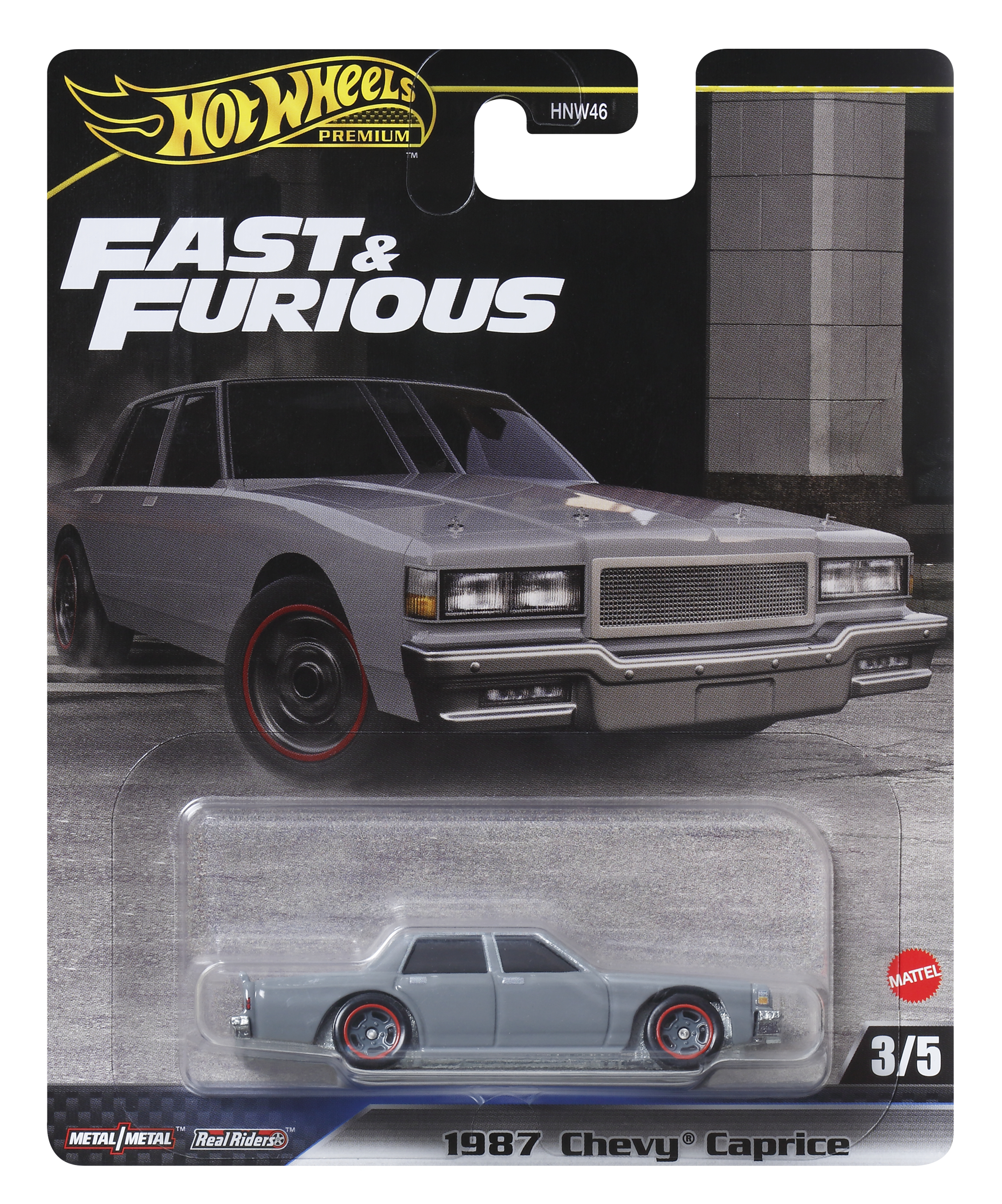 Opakowanie Hot Wheels z szarym samochodem Chevy Caprice z 1987 roku z czerwonymi felgami.