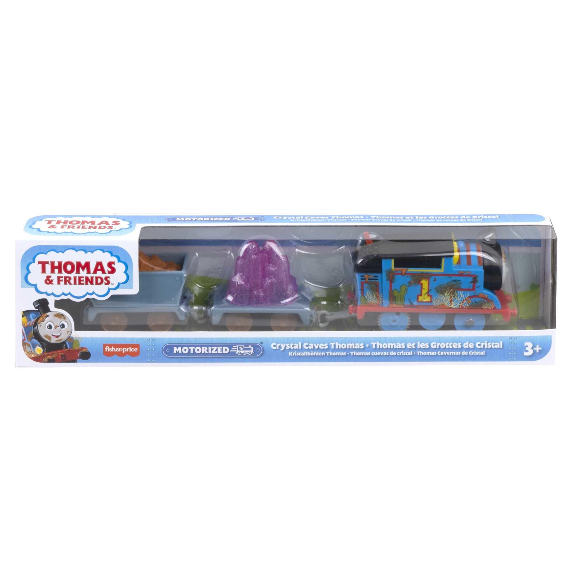 Thomas die Zugspielzeug-Set in der Verpackung. Zug, zwei Waggons und Gleise. Blauer Zug, lila Kristalle und braune Steine.