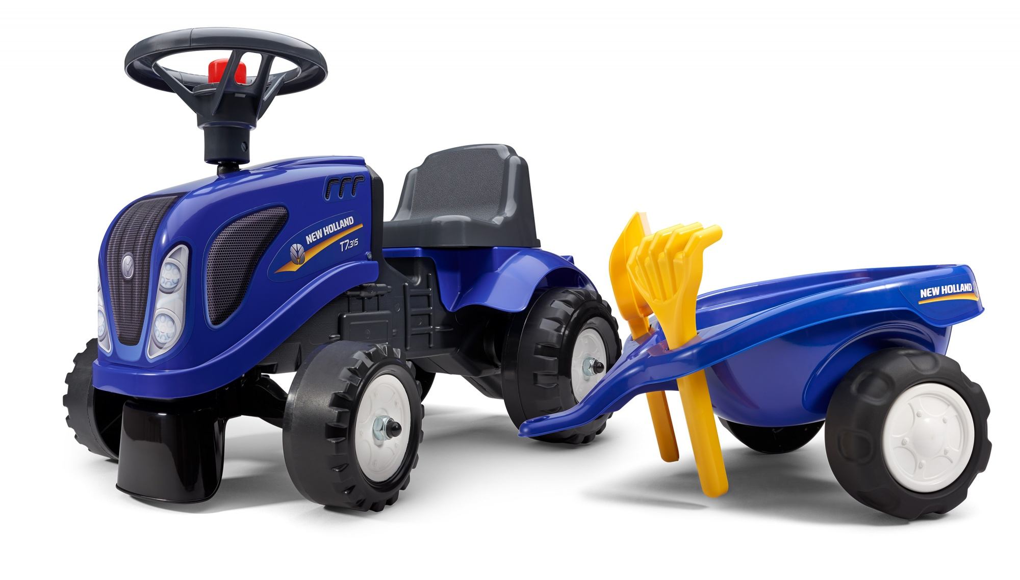 Un trattore giocattolo blu con un rimorchio. Le pale gialle sono sul rimorchio.