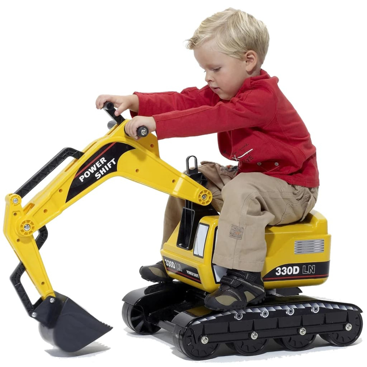 Chłopiec na żółtej zabawce-koparce. Koparka ma czarne gąsienice i napis 'POWER SHIFT' na ramieniu.
