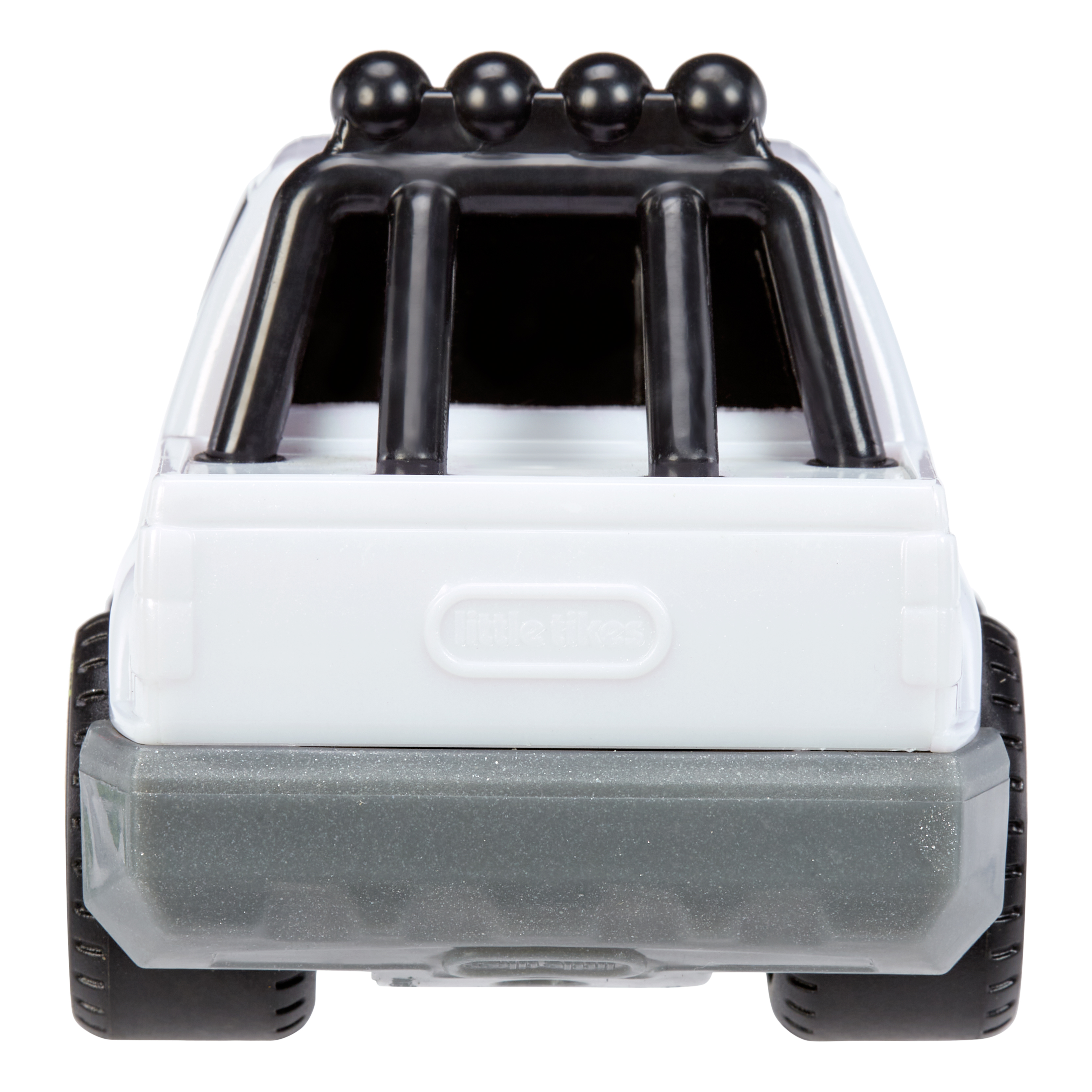 Biała i szara zabawka ciężarówka z czarnym pałąkiem ochronnym na górze, widok z tyłu.