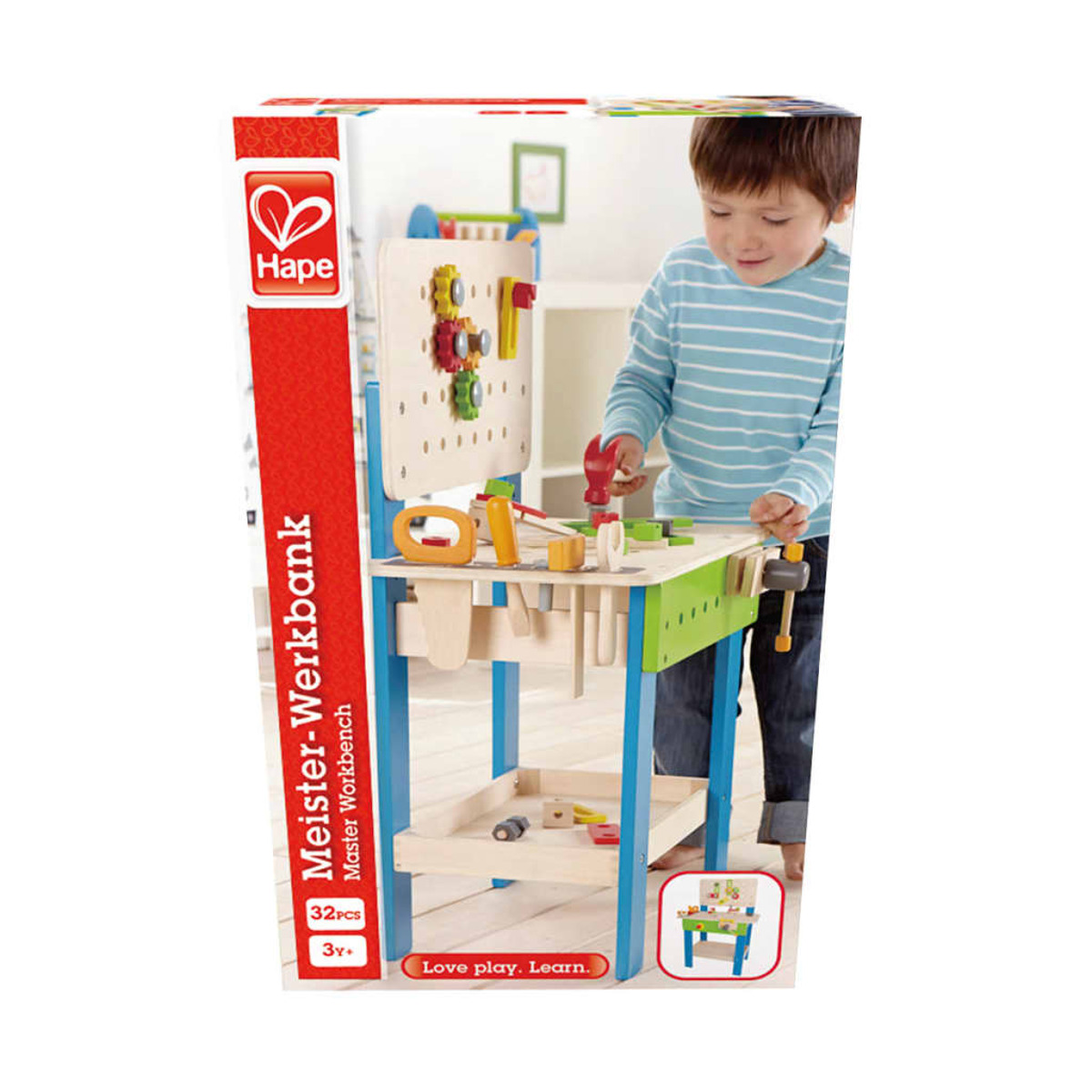 Dziecko bawiące się zabawką Hape Meister-Werkbank. Pudełko przedstawia warsztat i narzędzia.