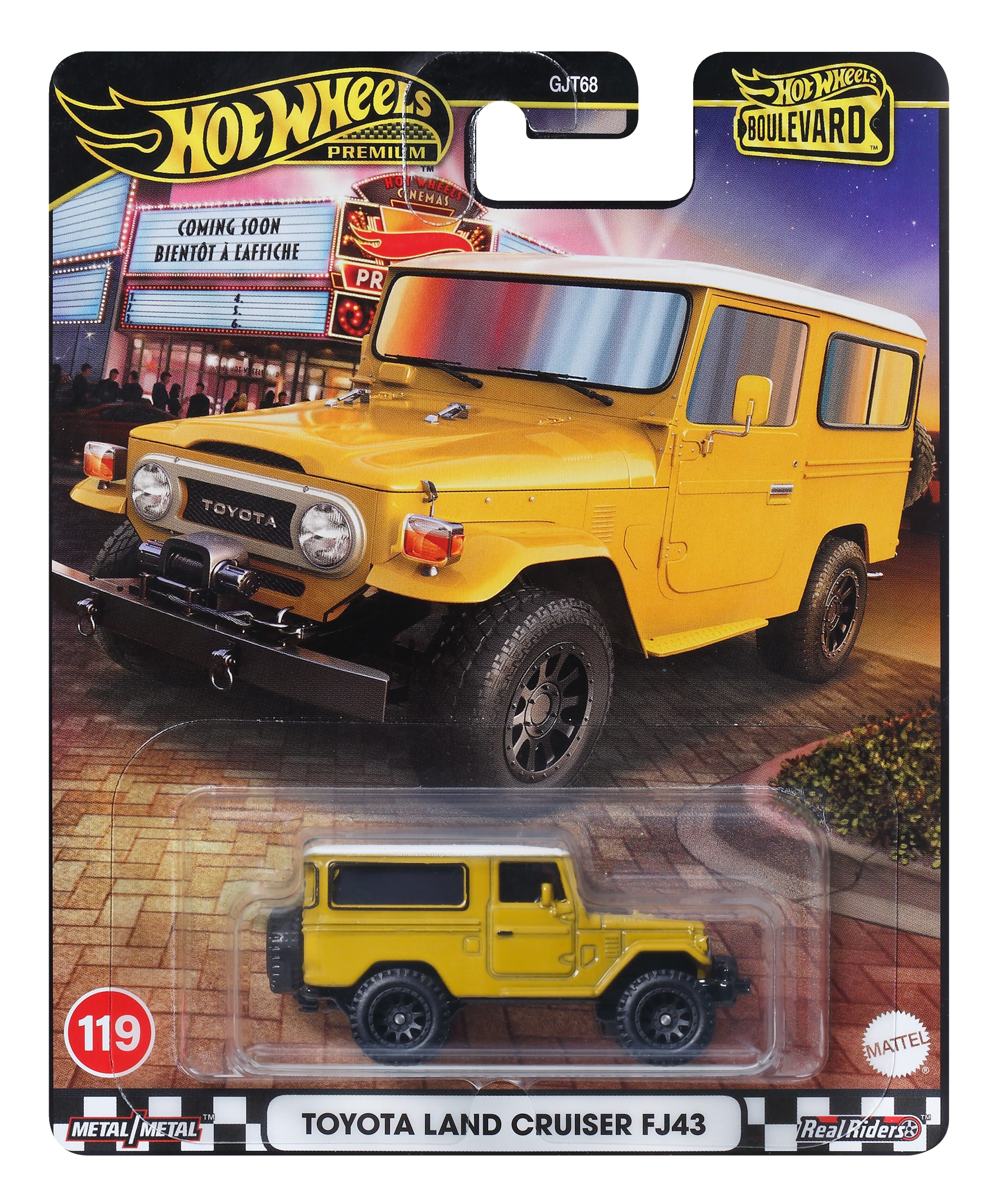 Żółty samochód zabawkowy Toyota Land Cruiser w opakowaniu Hot Wheels Boulevard z tłem kina.