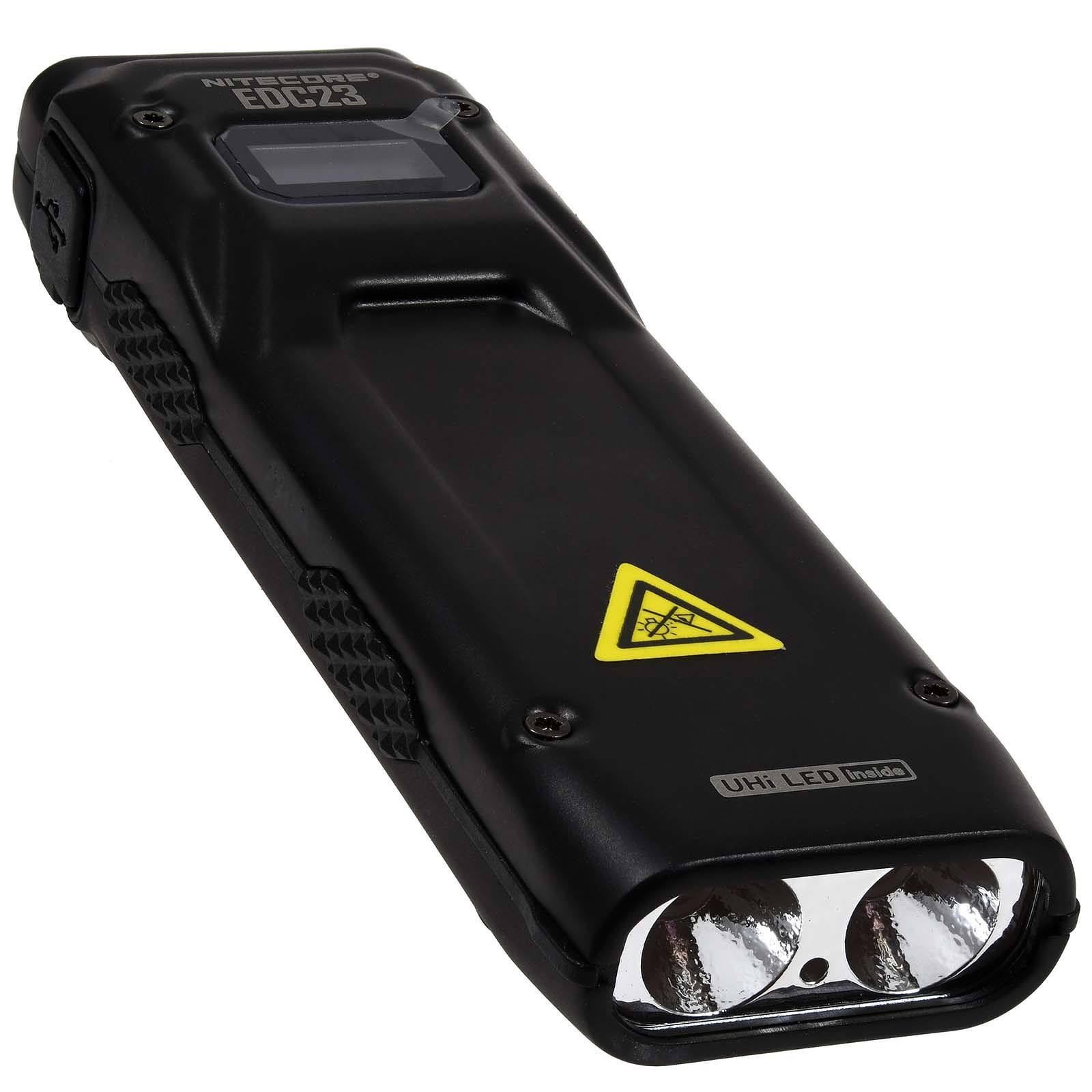 Czarna latarka z dwoma światłami i ekranem. Ma żółtą naklejkę ostrzegawczą.