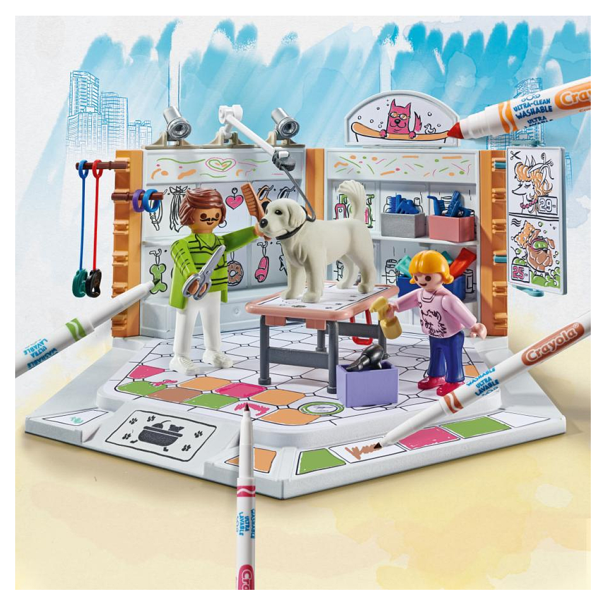 Playmobil dierenverzorgingsset. Twee figuren, hond, tafel en accessoires. Crayola-markers omringen de scène.