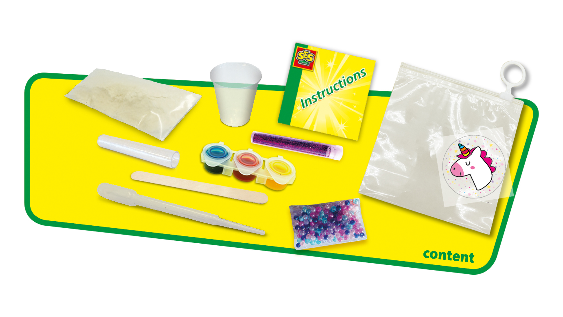 Un kit incluye instrucciones, polvos, una taza, un palito para remover, una pipeta, pinturas y una bolsa con un unicornio.