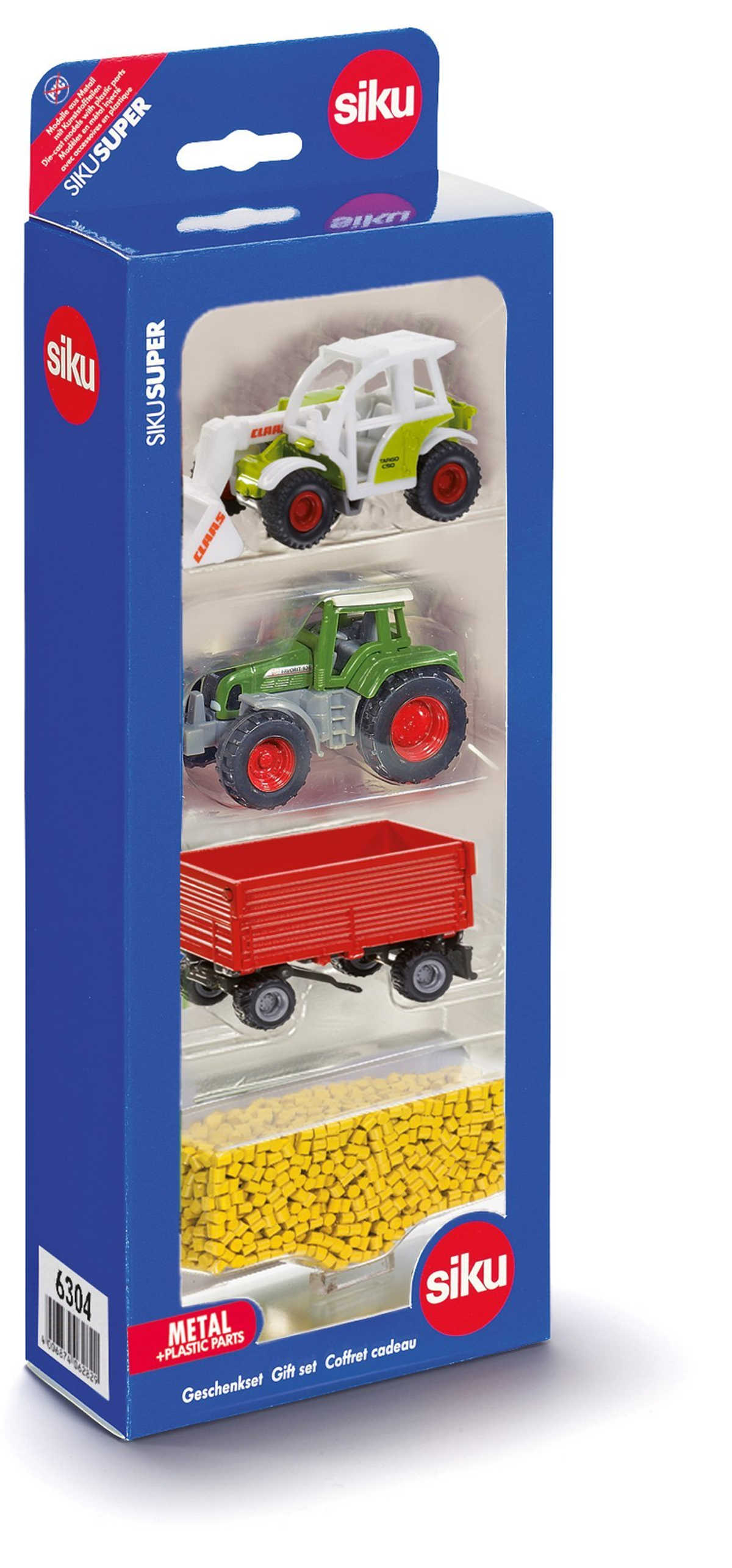 Juego de granja de juguete en caja: tractor verde, blanco, remolque rojo, bolitas amarillas.
