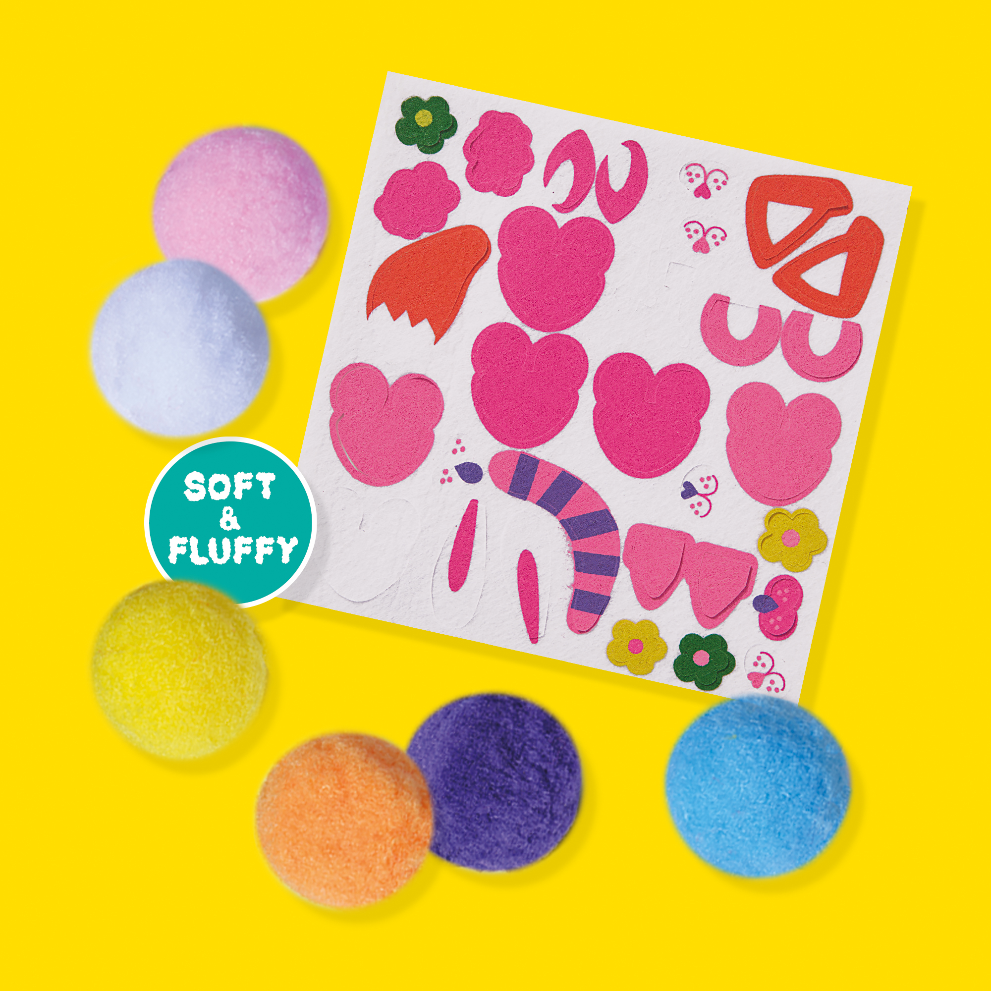 Zestaw rzemieślniczy z pomponami, filcowymi kształtami i naklejkami. Żółte i niebieskie pompony.