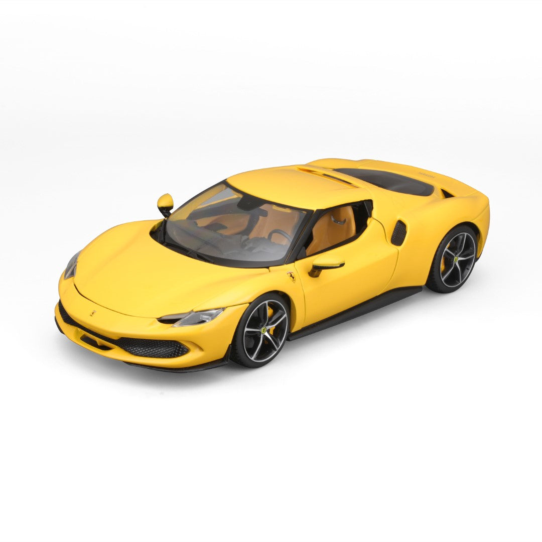 Żółty zabawkowy samochód Ferrari. Białe tło.
