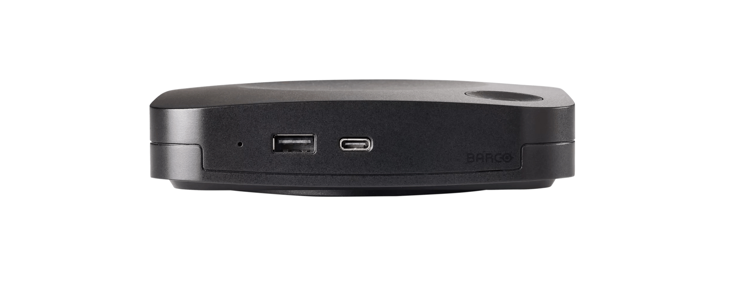 Dispositivo nero rettangolare con porte USB e USB-C. Il marchio 'BARCO' è visibile.
