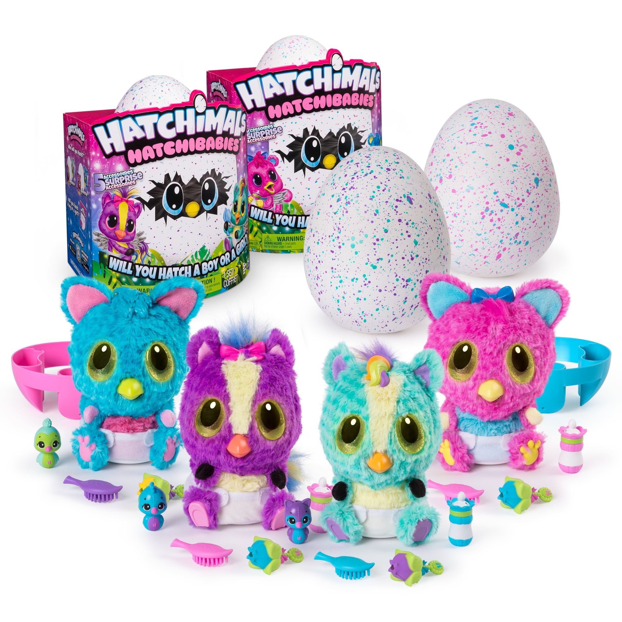 Zabawki Hatchimals: jajka, pluszaki i akcesoria. Pudełka i jajka w tle. Różne kolory.
