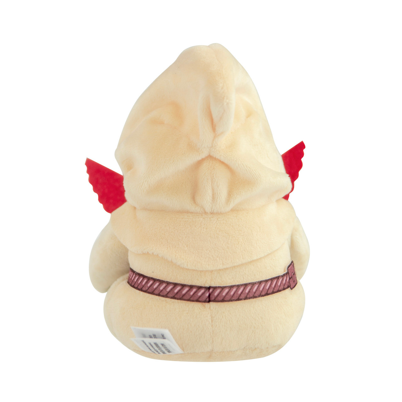Une peluche dans un sweat à capuche beige avec des ailes rouges dans le dos.