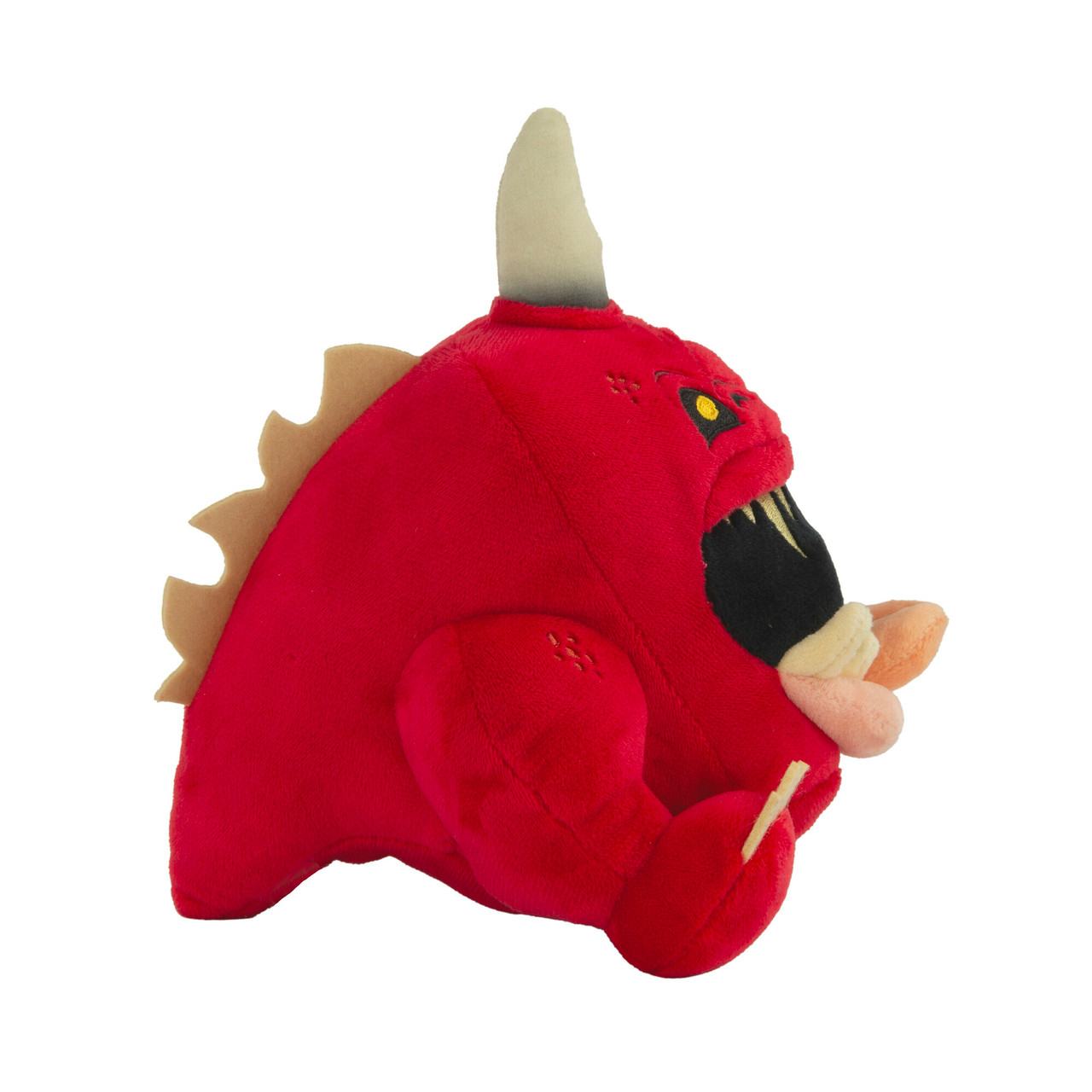 Jouet monstre en peluche rouge. Corne blanche, œil jaune et sourire édenté. Fond blanc.