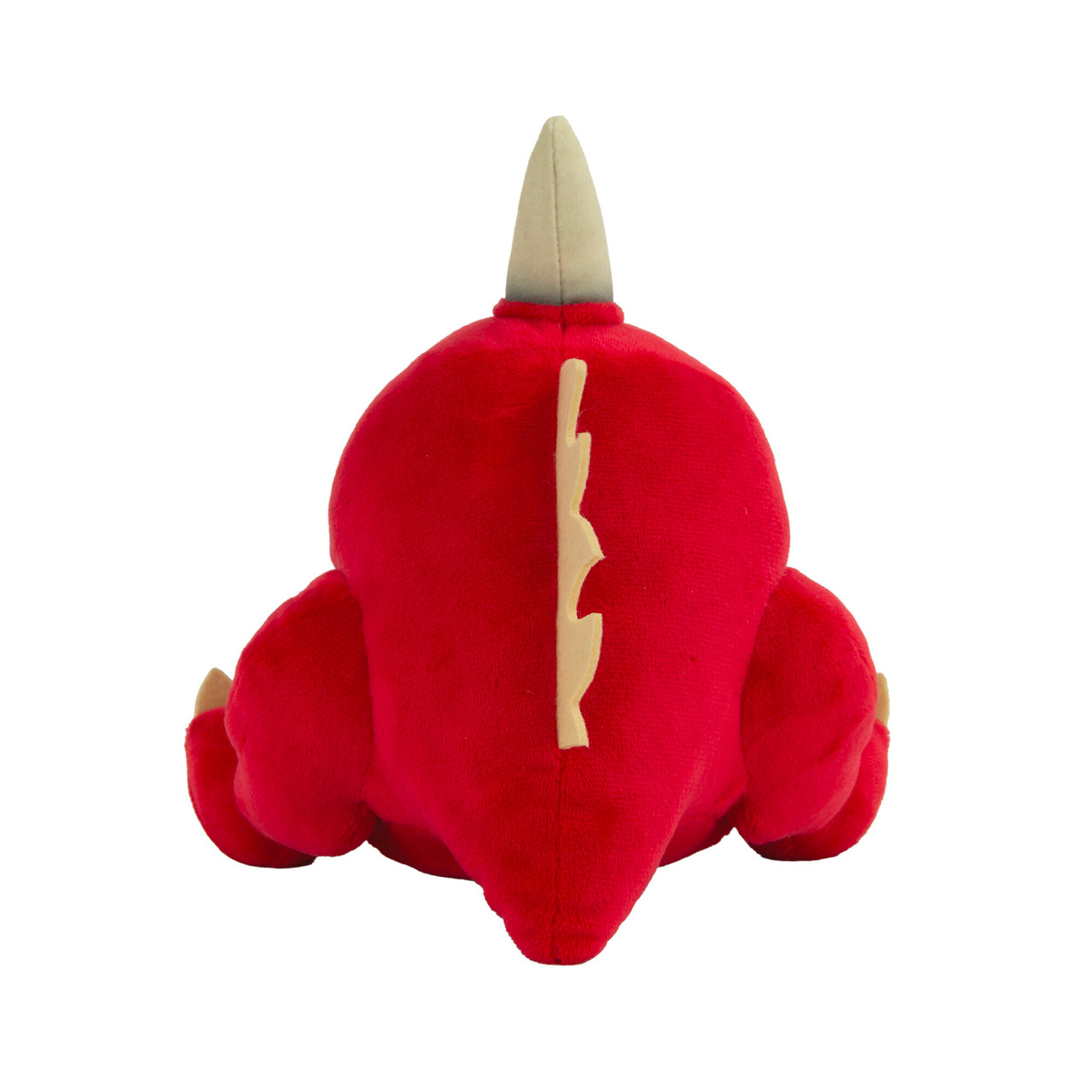 Un jouet dinosaure en peluche rouge, vue arrière, avec une épine dorsale blanche et une corne blanche.