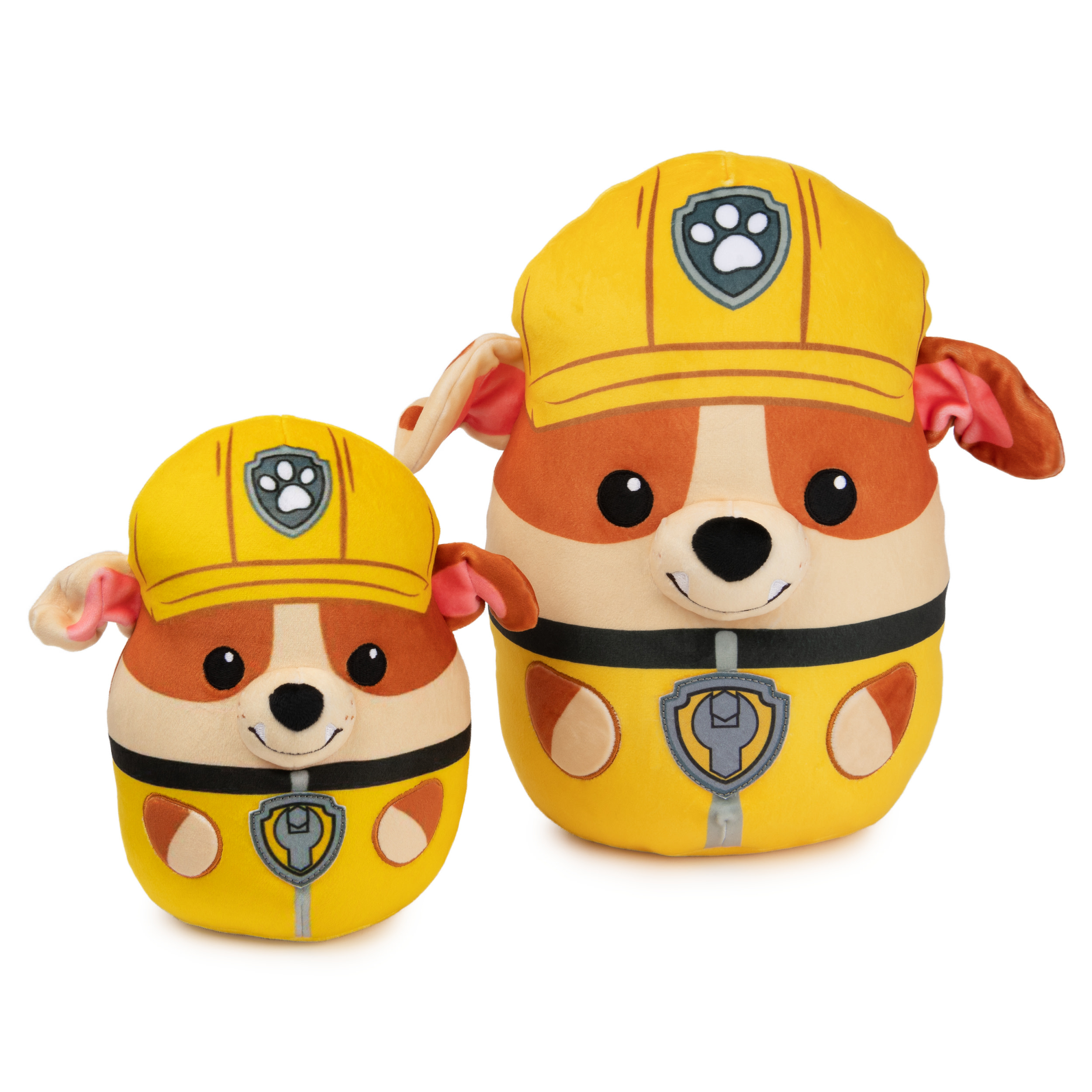 Due peluche gialli di Marshall Paw Patrol. Uno è più grande, entrambi hanno cappelli e uniformi.
