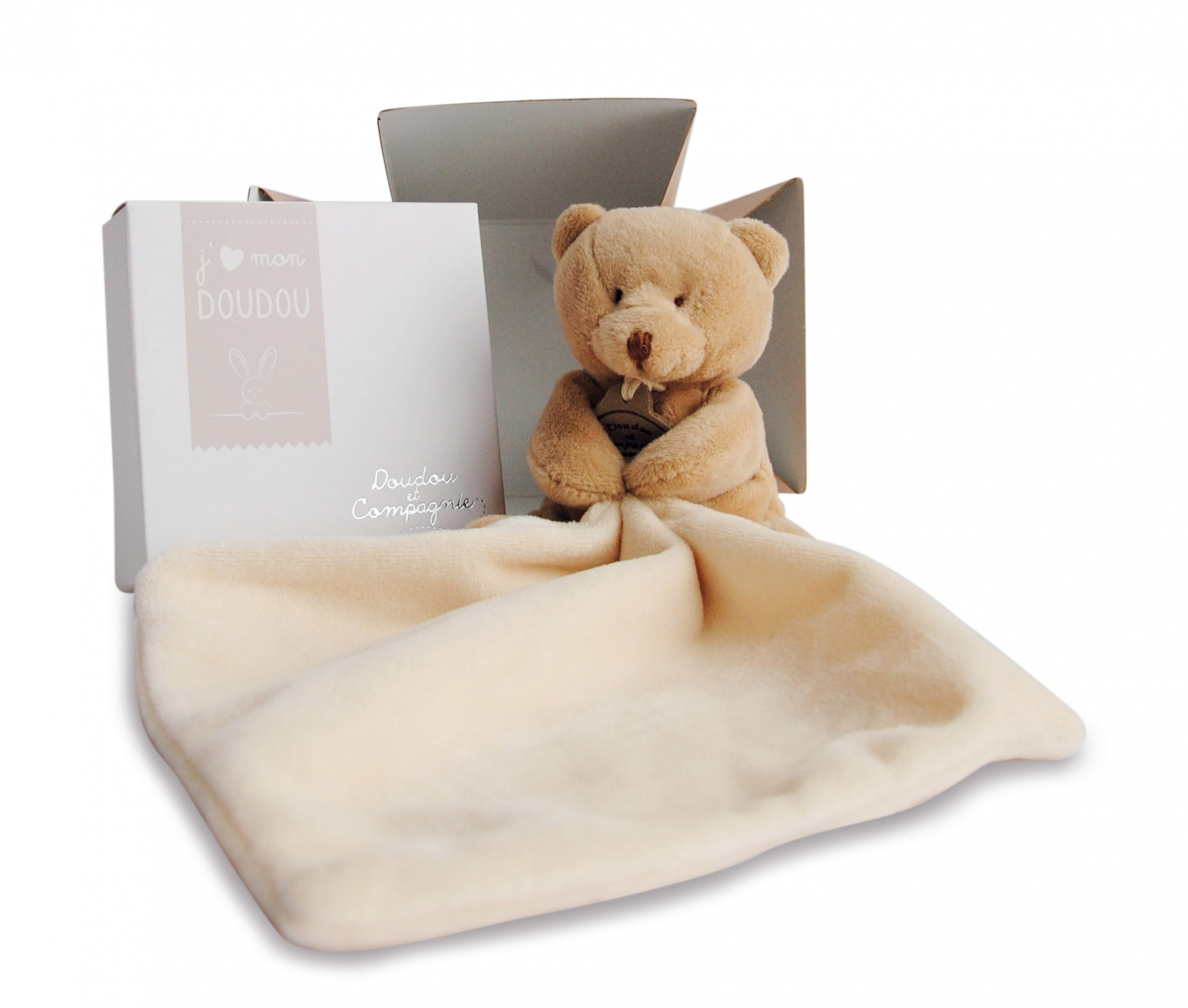 Miś pluszowy i kocyk w pudełku. Tekst na pudełku brzmi 'j'aime mon doudou' i 'Doudou Compagnie'.