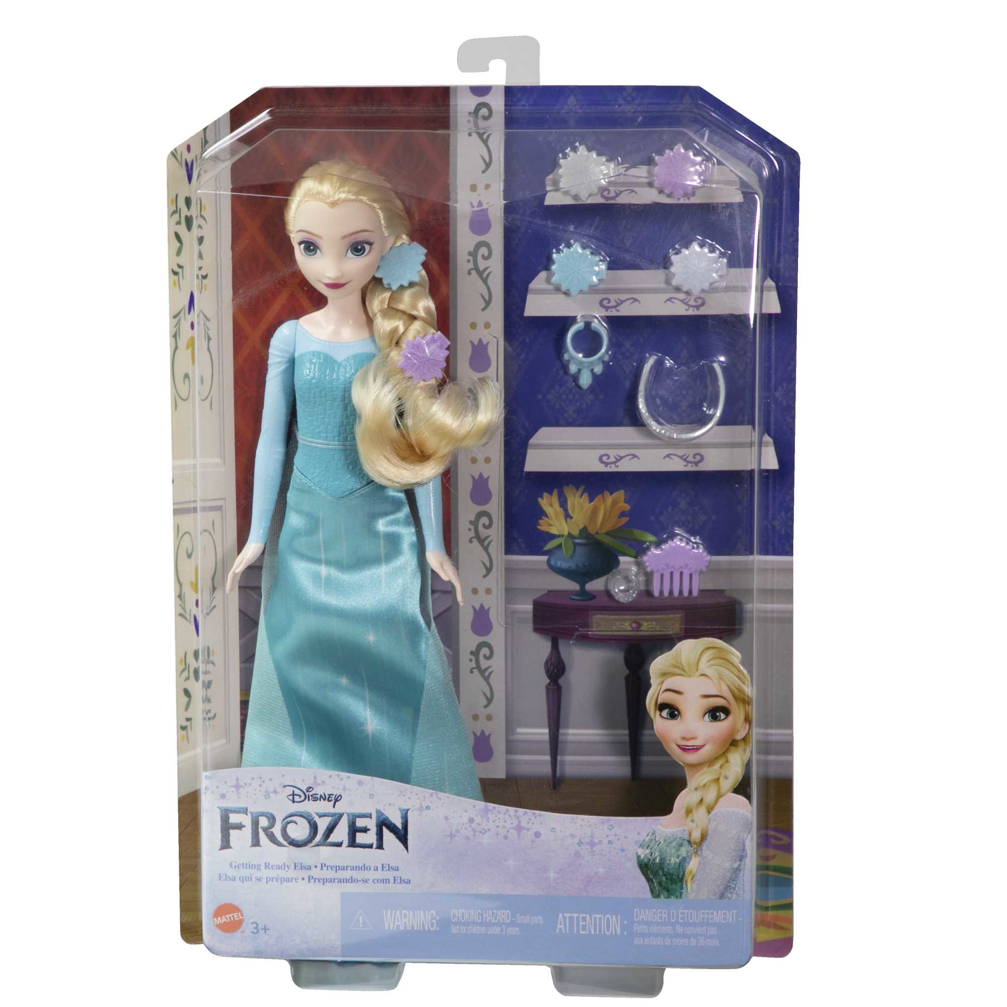 Lalka Elsa z Krainy Lodu w pudełku. Ma na sobie niebieską sukienkę, akcesoria są po prawej stronie.