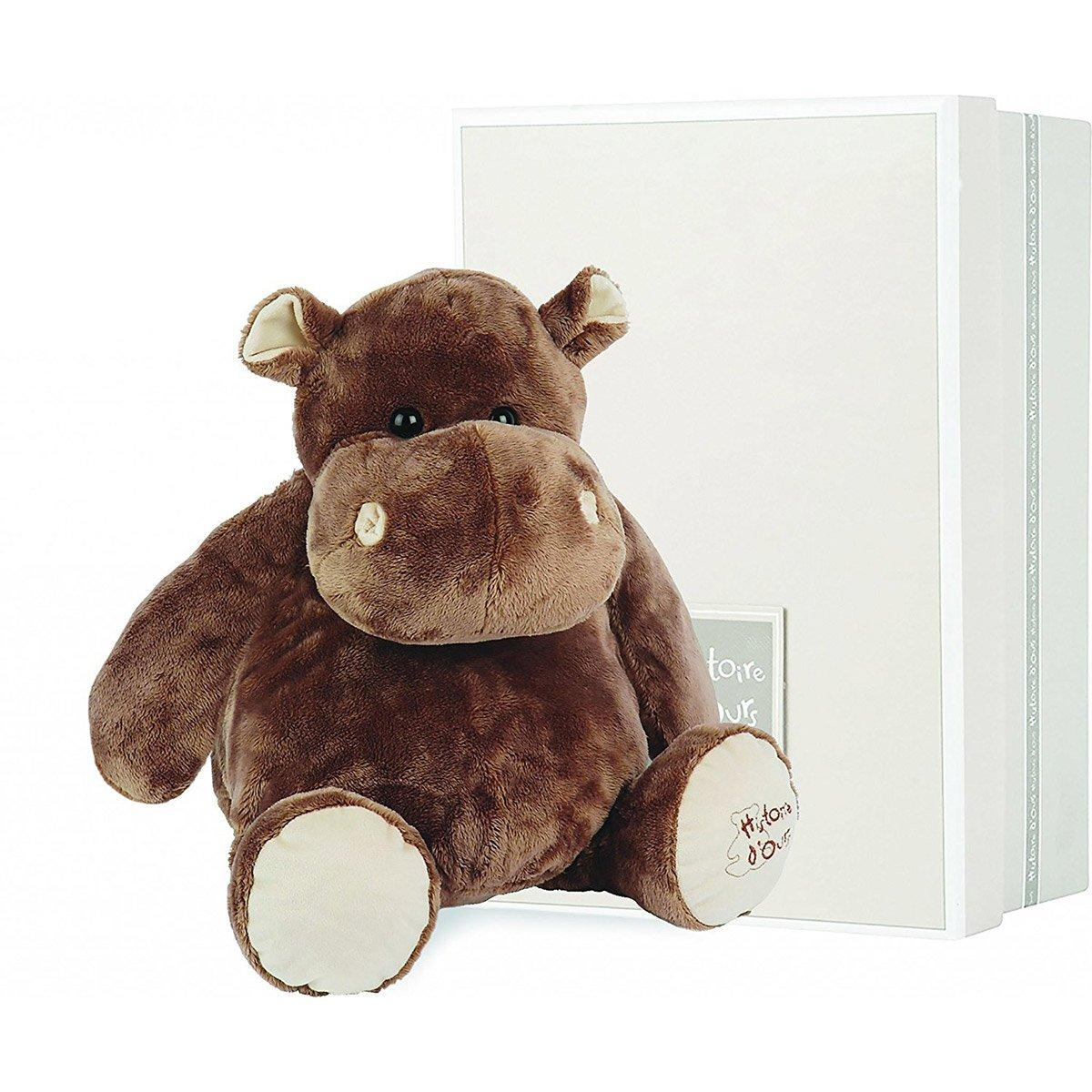 Braunes Nilpferd-Plüschtier mit weißem Buchhintergrund.