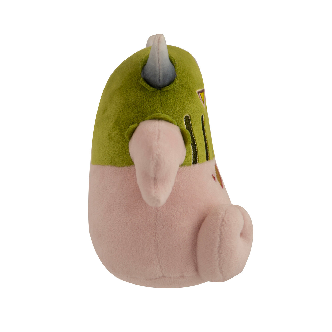 Peluche rosa e verde, vista laterale, con corna e occhi.