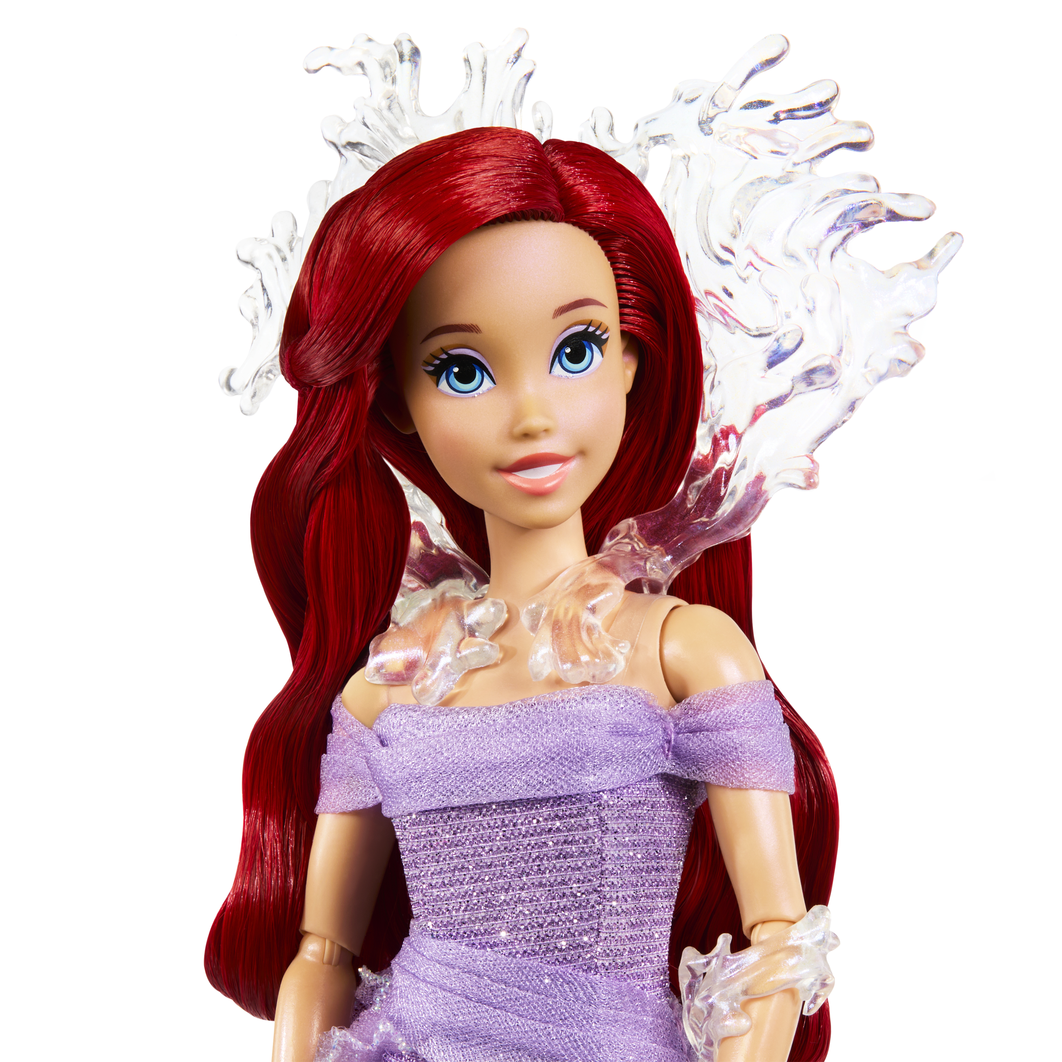Ariel-Puppe mit roten Haaren, lila Kleid und Wassereffekten.