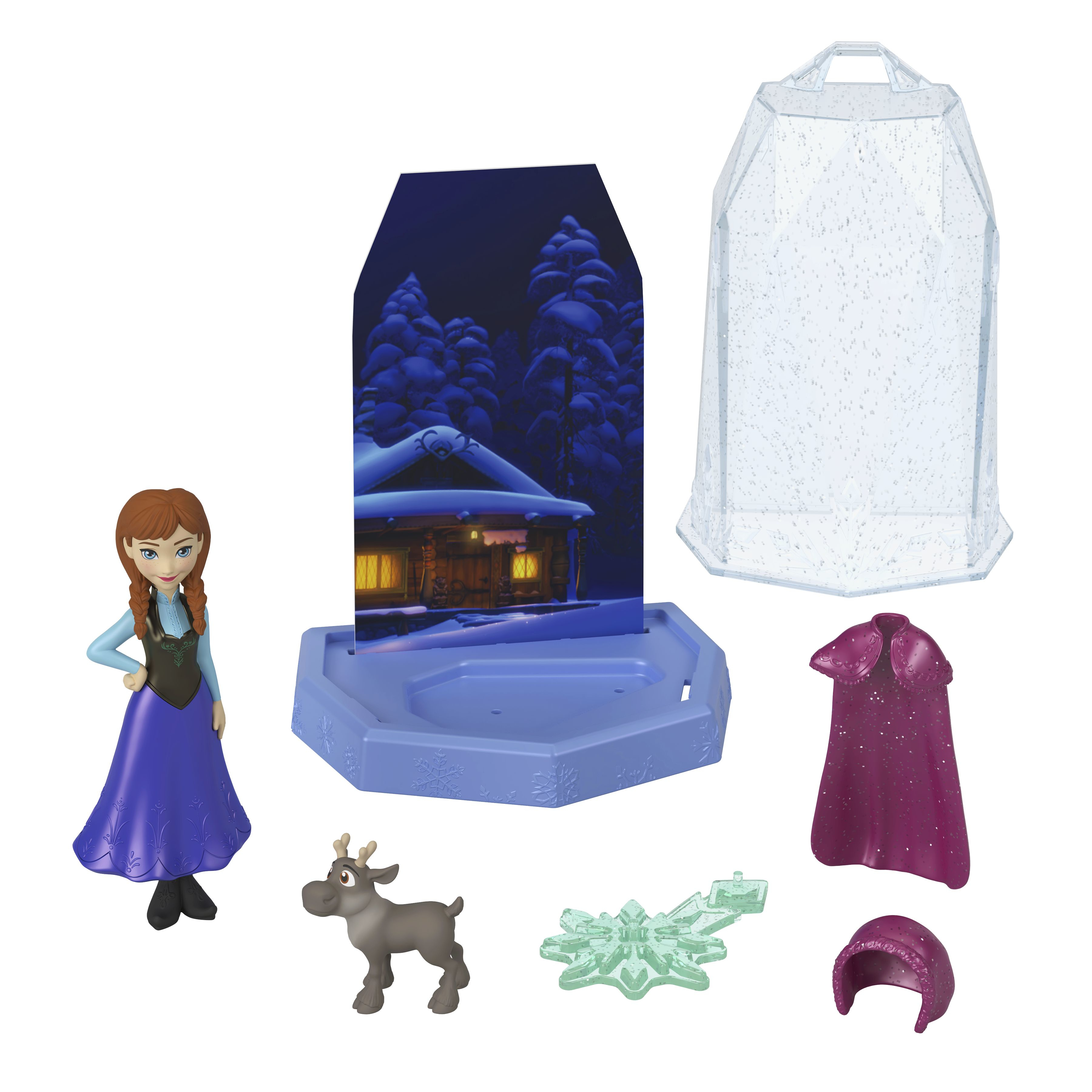 Zestaw do zabawy Frozen. Zawiera Annę, renifera, kulę śnieżną i tło z zimową scenerią. Białe tło.