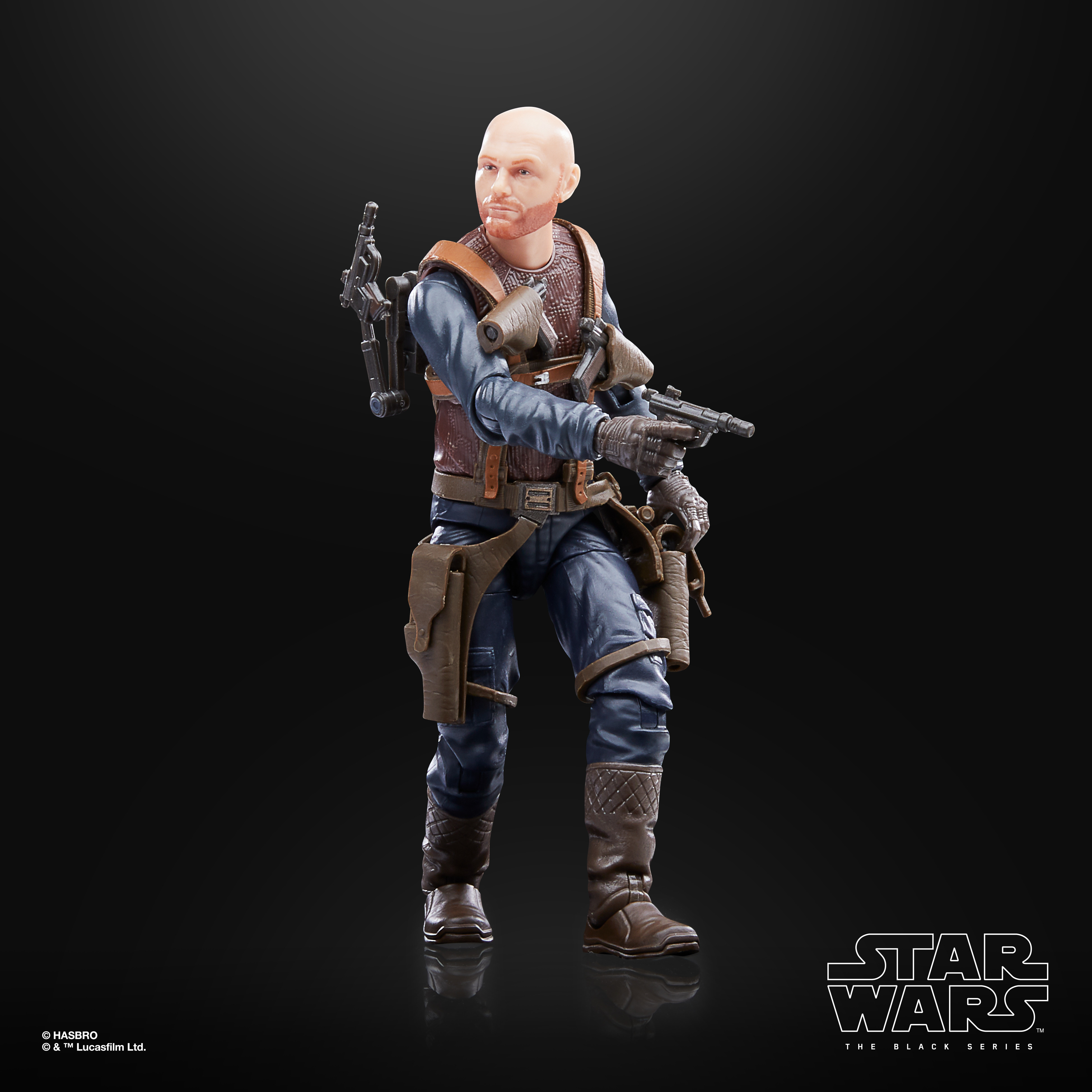 Star Wars Actionfigur eines glatzköpfigen Mannes in Militärausrüstung, der eine Waffe hält. Schwarzer Hintergrund.