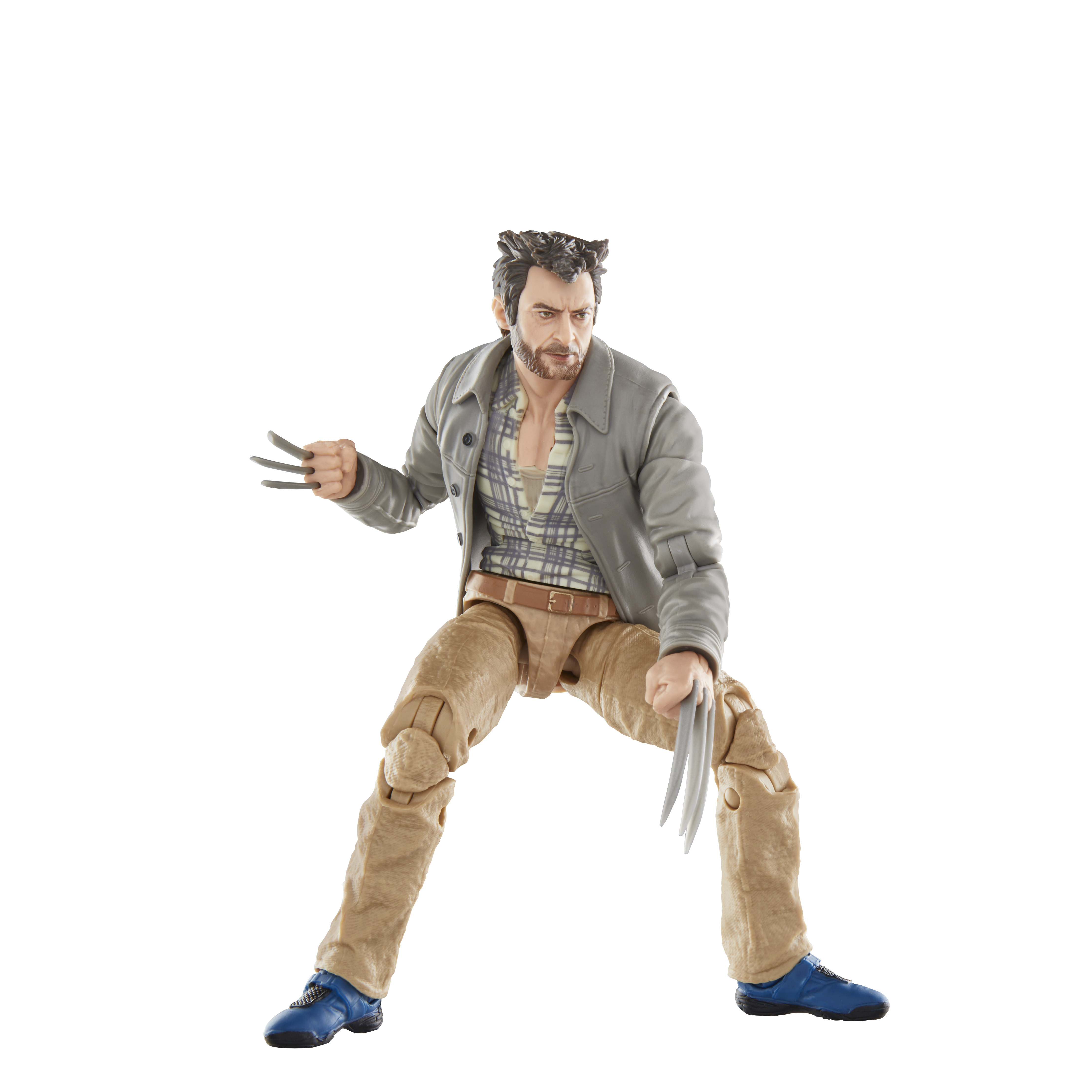 Figurka Wolverine. Brązowe spodnie, szara kurtka. Białe tło.