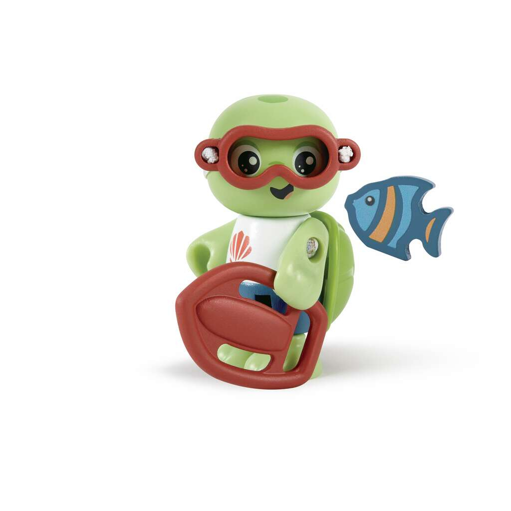 Zielona zabawka żółwia w okularach, trzymająca czerwoną boję, obok niebieska i pomarańczowa zabawka ryby.
