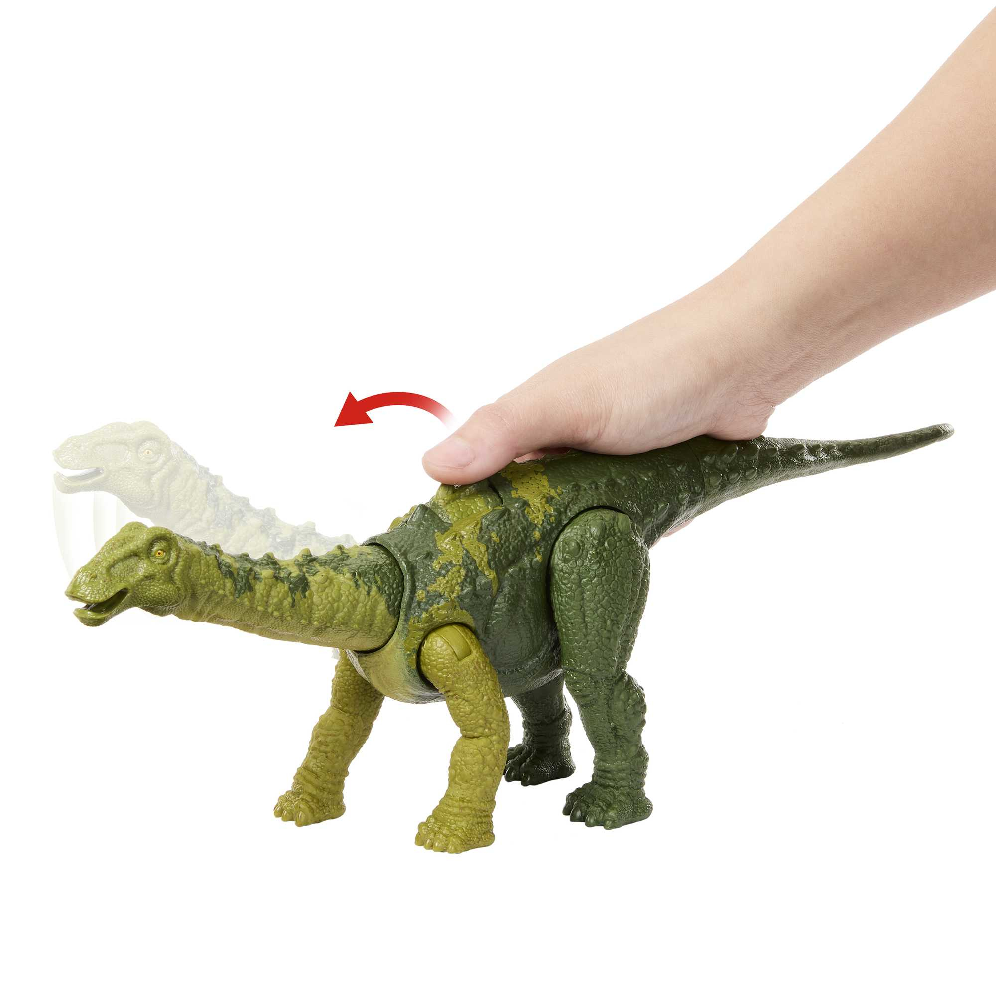 Un giocattolo di dinosauro verde e marrone. Una mano interagisce con il giocattolo spingendolo.