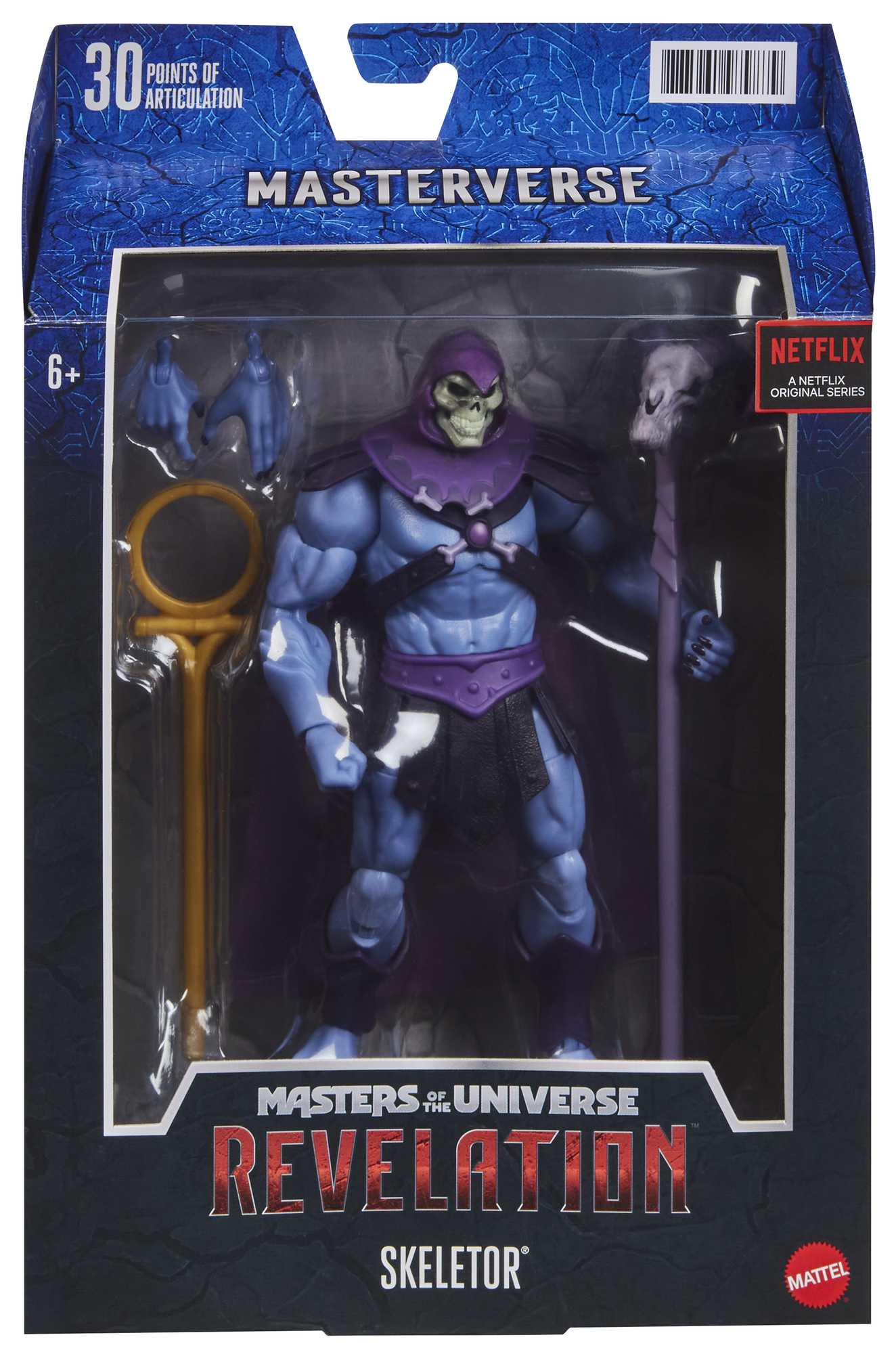 Una figura de acción de Skeletor en una caja. Es azul, morado y negro, con un bastón y una espada.