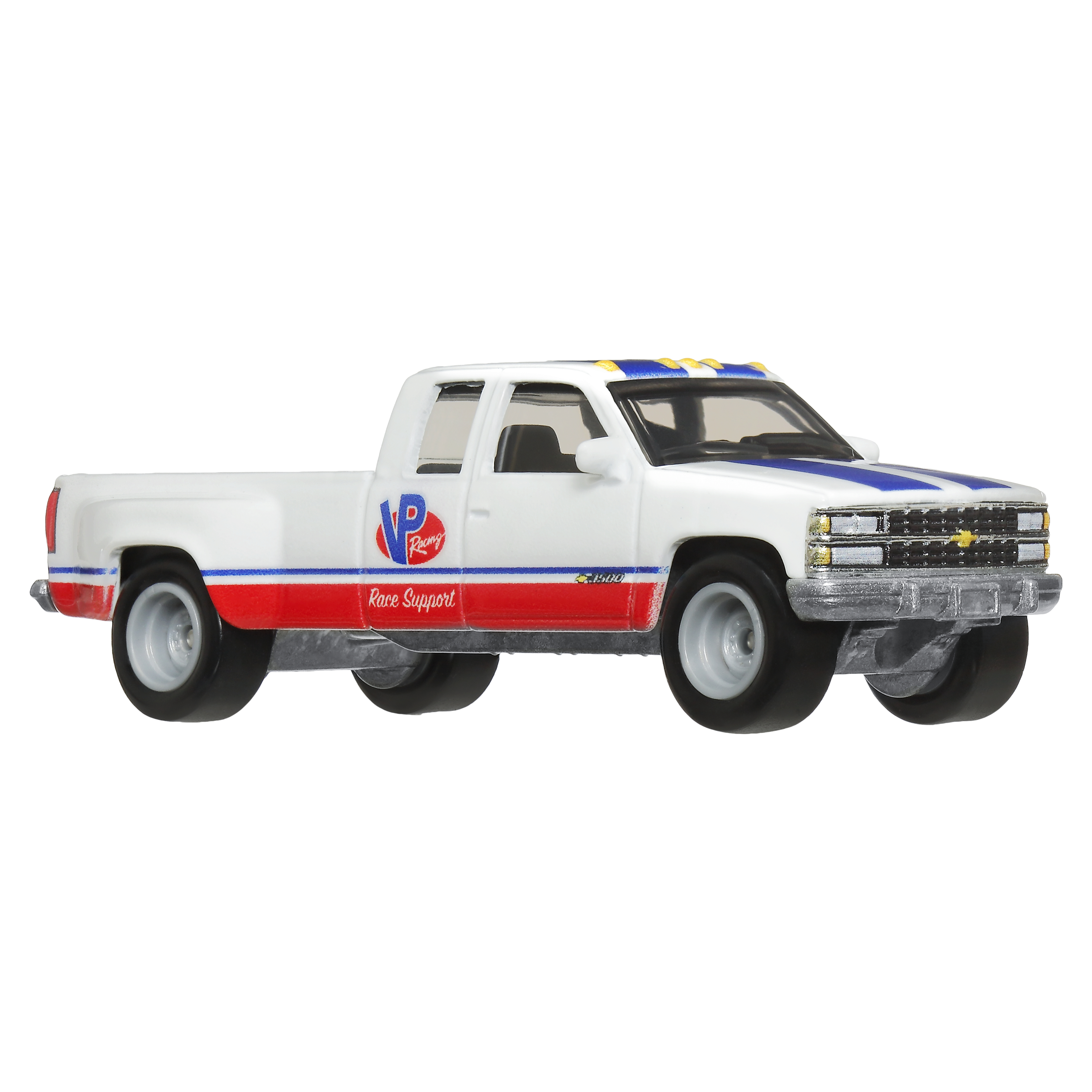 Weißer Pick-up-Truck mit roten und blauen Rennstreifen und 'VP Racing' an der Seite.