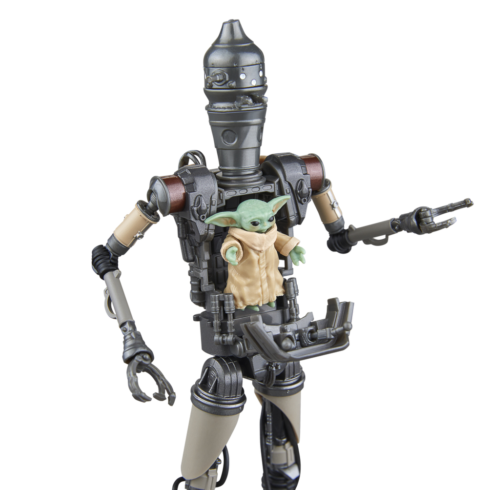 Figurka robota z Baby Yodą w środku.
