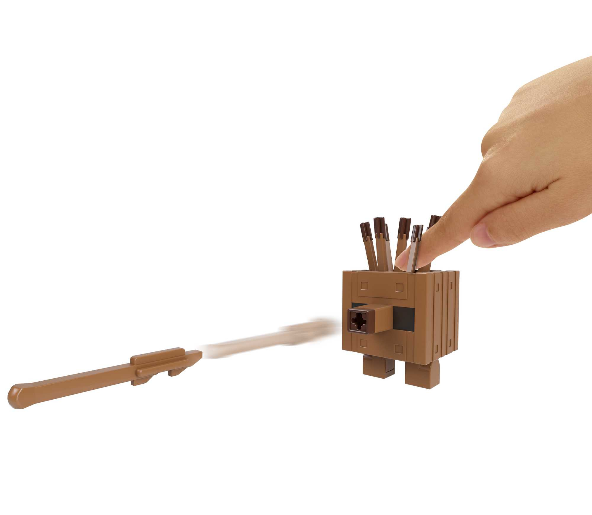 Eine Hand berührt eine braune Minecraft-Spielzeugfigur mit Projektilen.