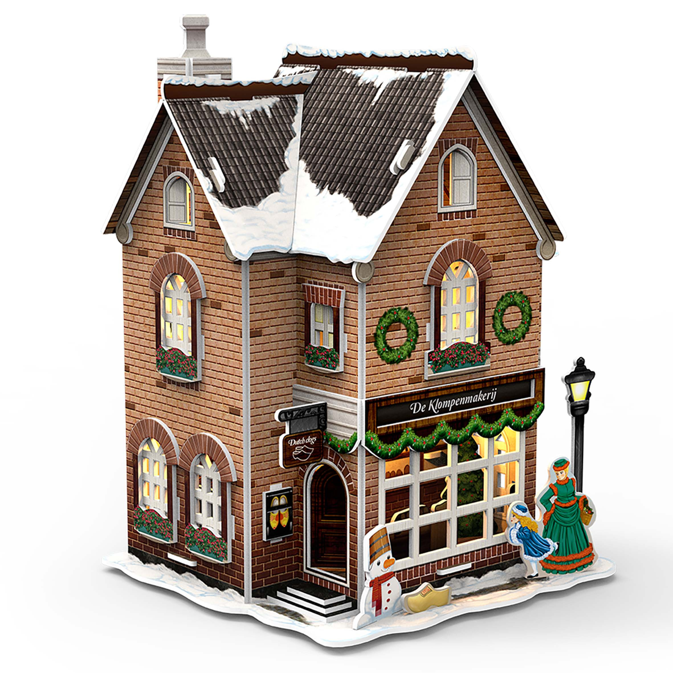Un puzzle 3D di una casa olandese con decorazioni e figure natalizie.