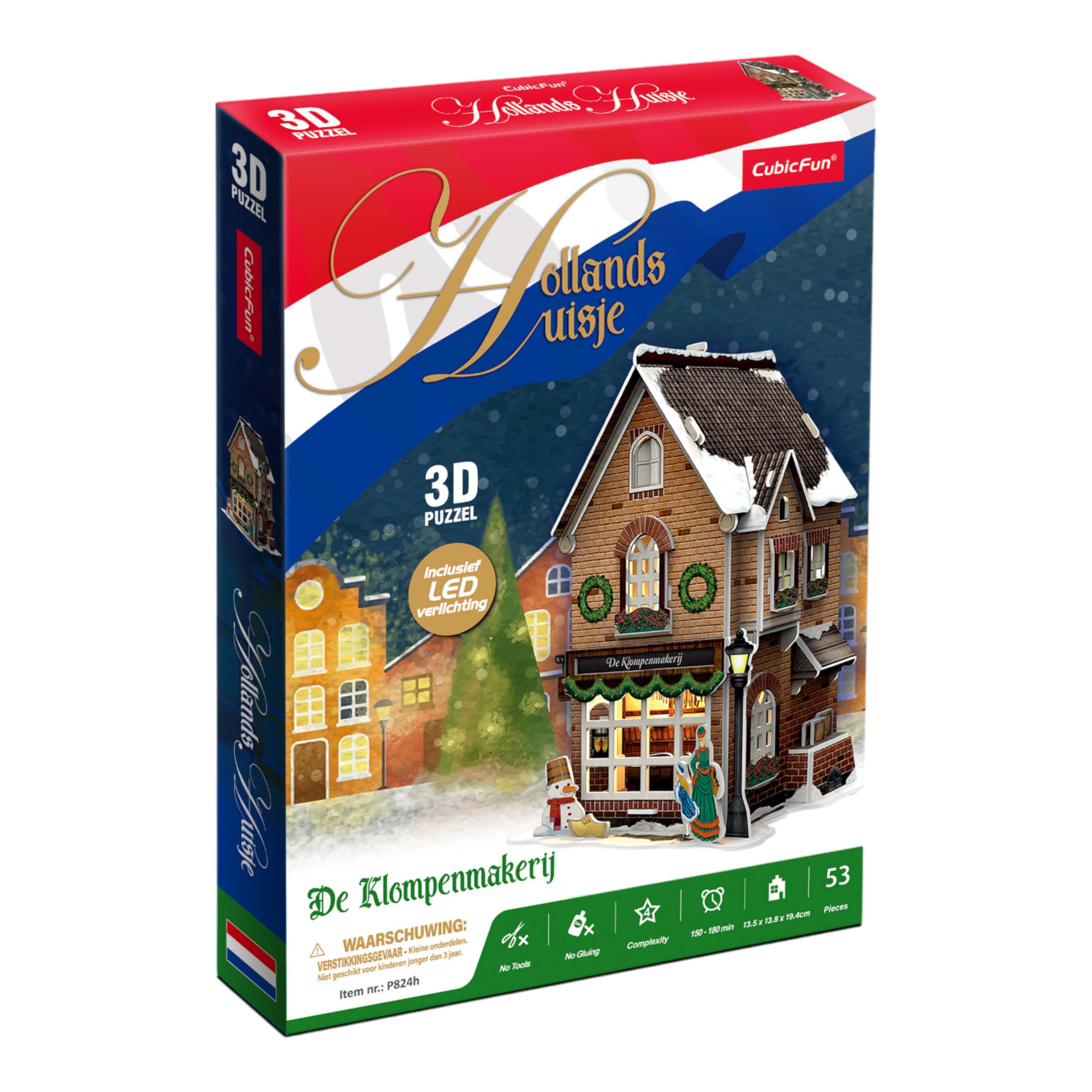 Una scatola di puzzle 3D di una casa olandese con un mulino a vento e neve.