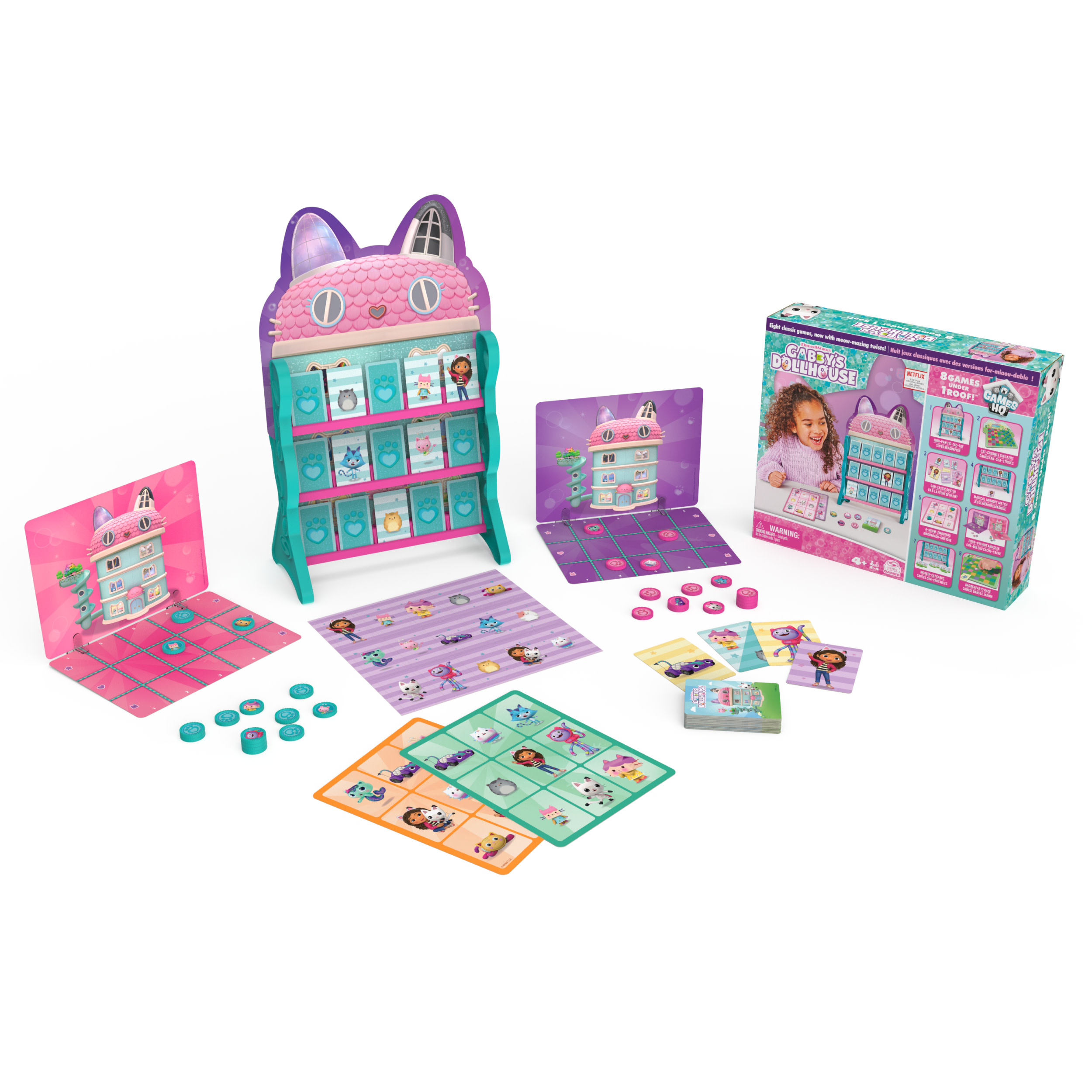 Boîte de jeu et composants de Gabby's Dollhouse. Un jeu rose sur le thème des chats.