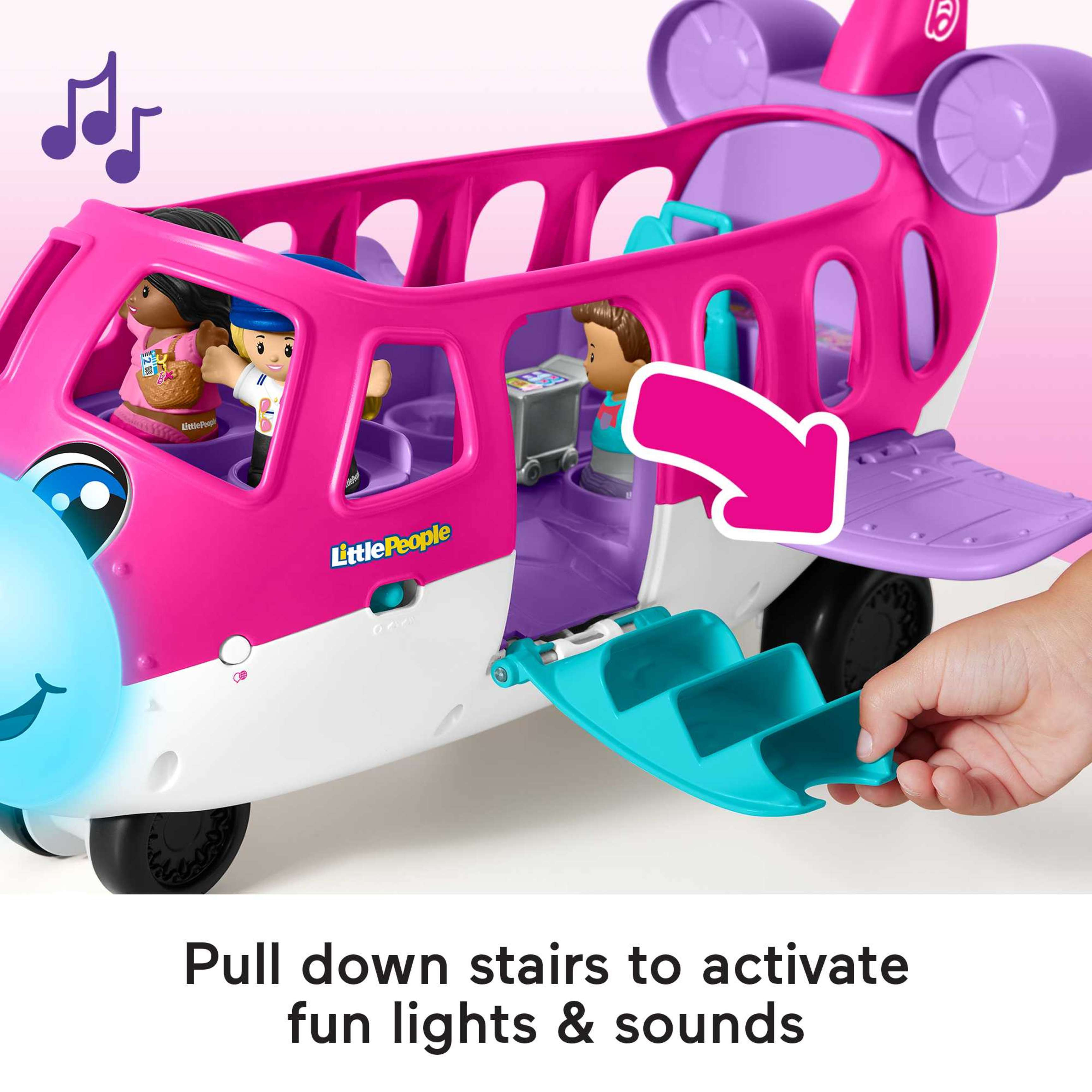 Dziecko opuszcza schody w różowym samolocie z figurkami.