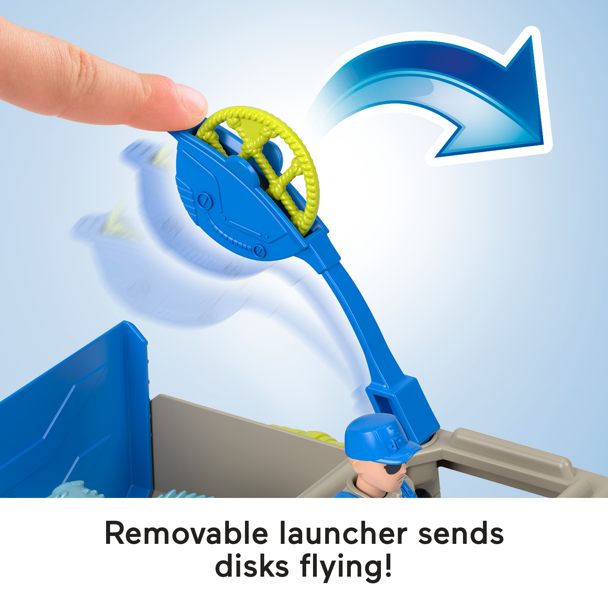 Palec naciska niebieski panel na zabawkowym pojeździe, wysyłając dysk w powietrze.