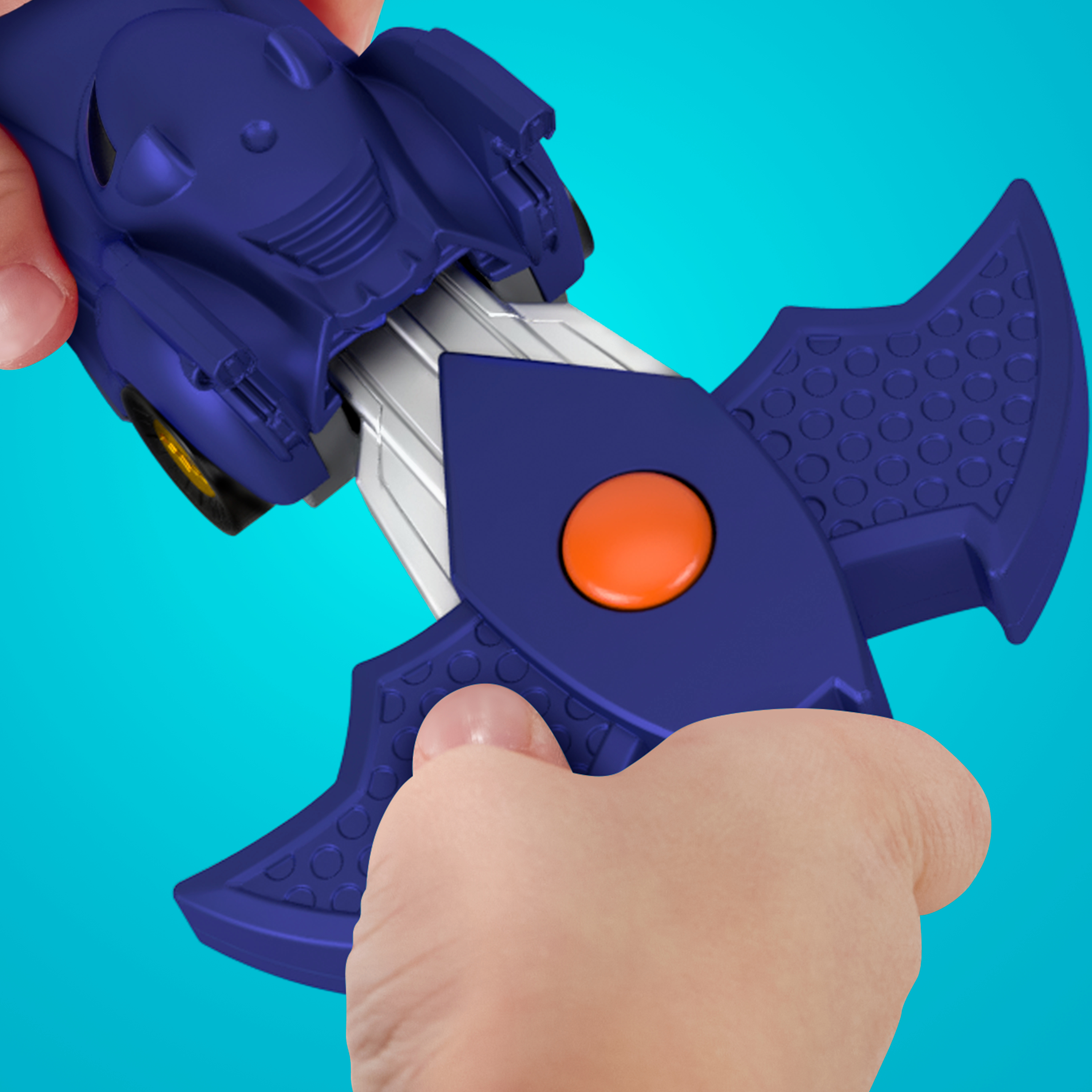 Zabawkowe auto z niebieskim nadwoziem i akcesorium w kształcie nietoperza. Akcesorium ma pomarańczowy przycisk.