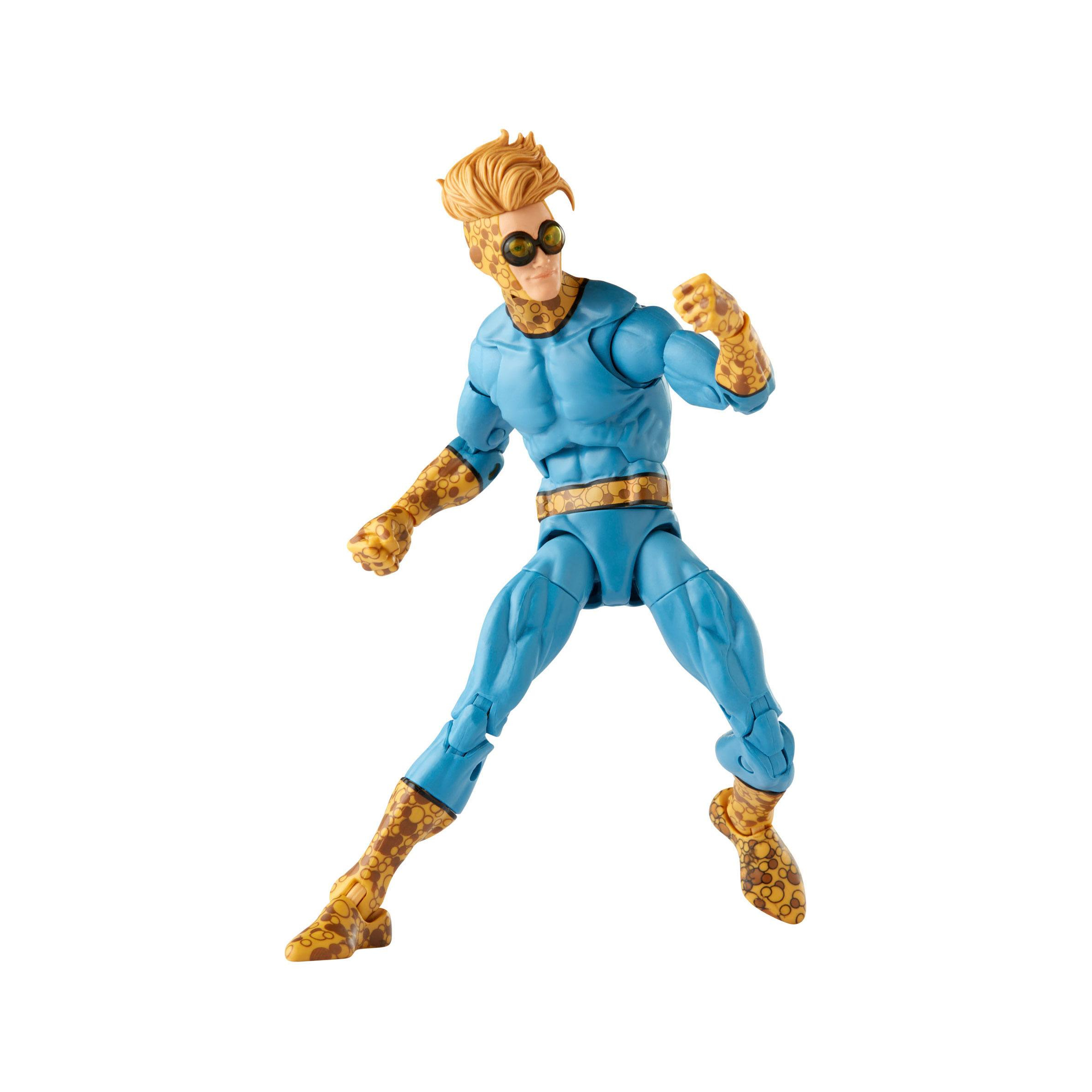 Figura de acción en pose dinámica. Traje azul con detalles dorados, pelo rubio y gafas, en acción.