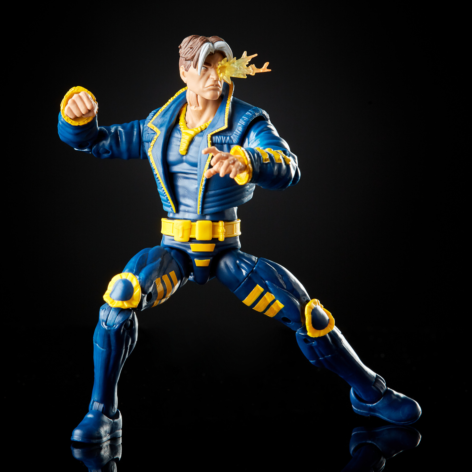 Una figura giocattolo di un supereroe con un'uniforme blu e gialla e un'esplosione di energia.