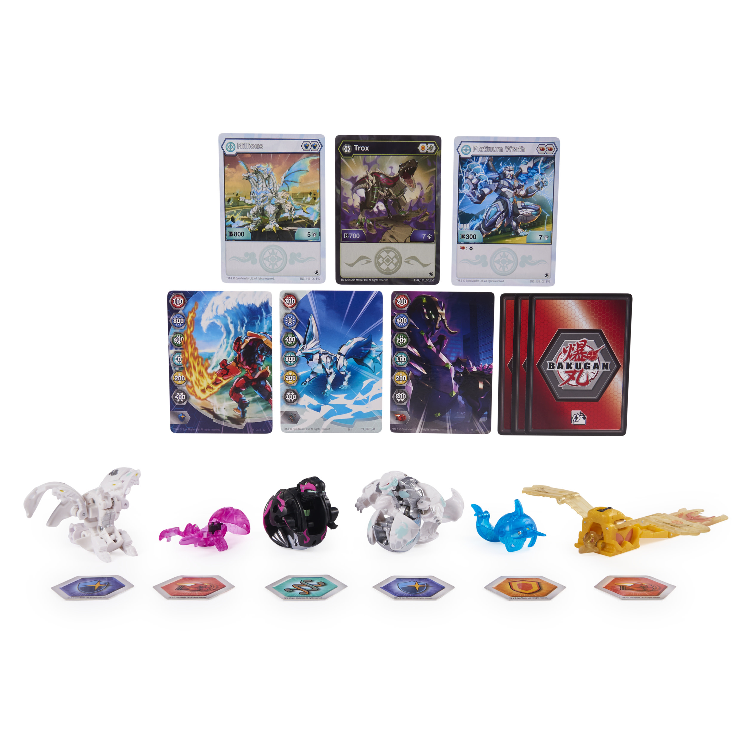 Kolekcja zabawek Bakugan i kart kolekcjonerskich. Wyświetlanych jest kilka Bakuganów i kart.