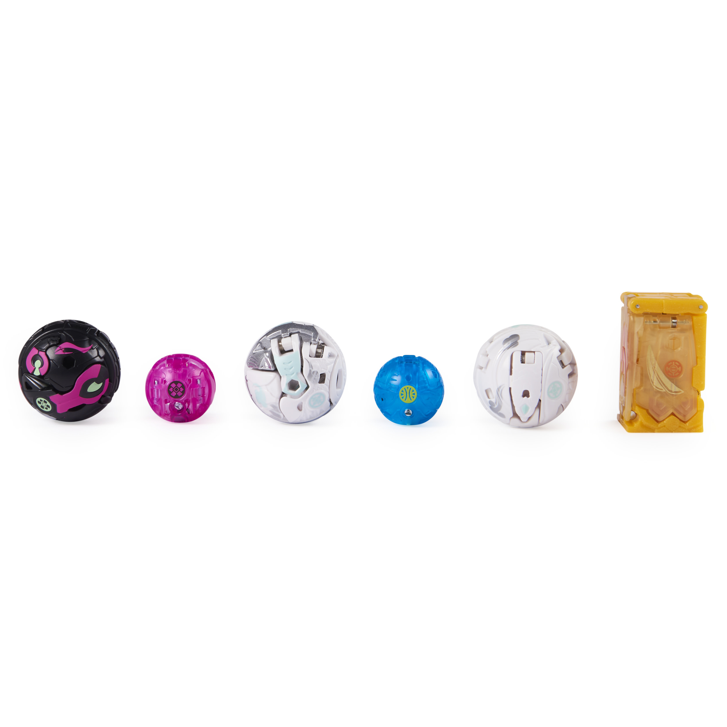 Sześć kulek Bakugan w rzędzie. Różne kolory i wzory, ułożone na białym tle.