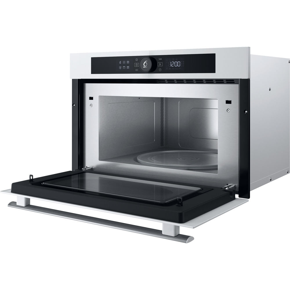 Forno a microonde incassato con porta aperta. Interno visibile con pannello.