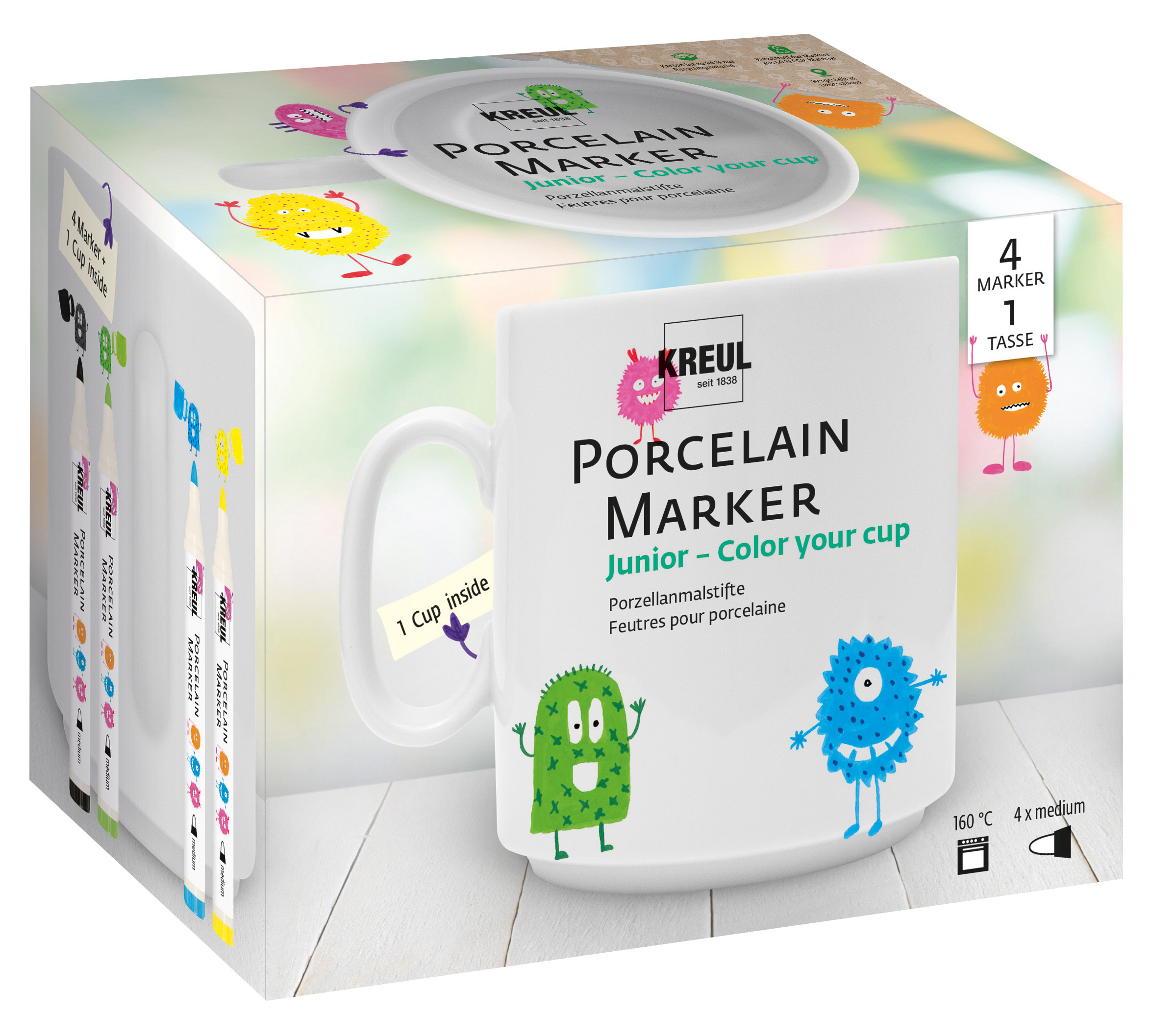 Biały kubek z postaciami z kreskówek i pudełko markerów do porcelany do kolorowania.