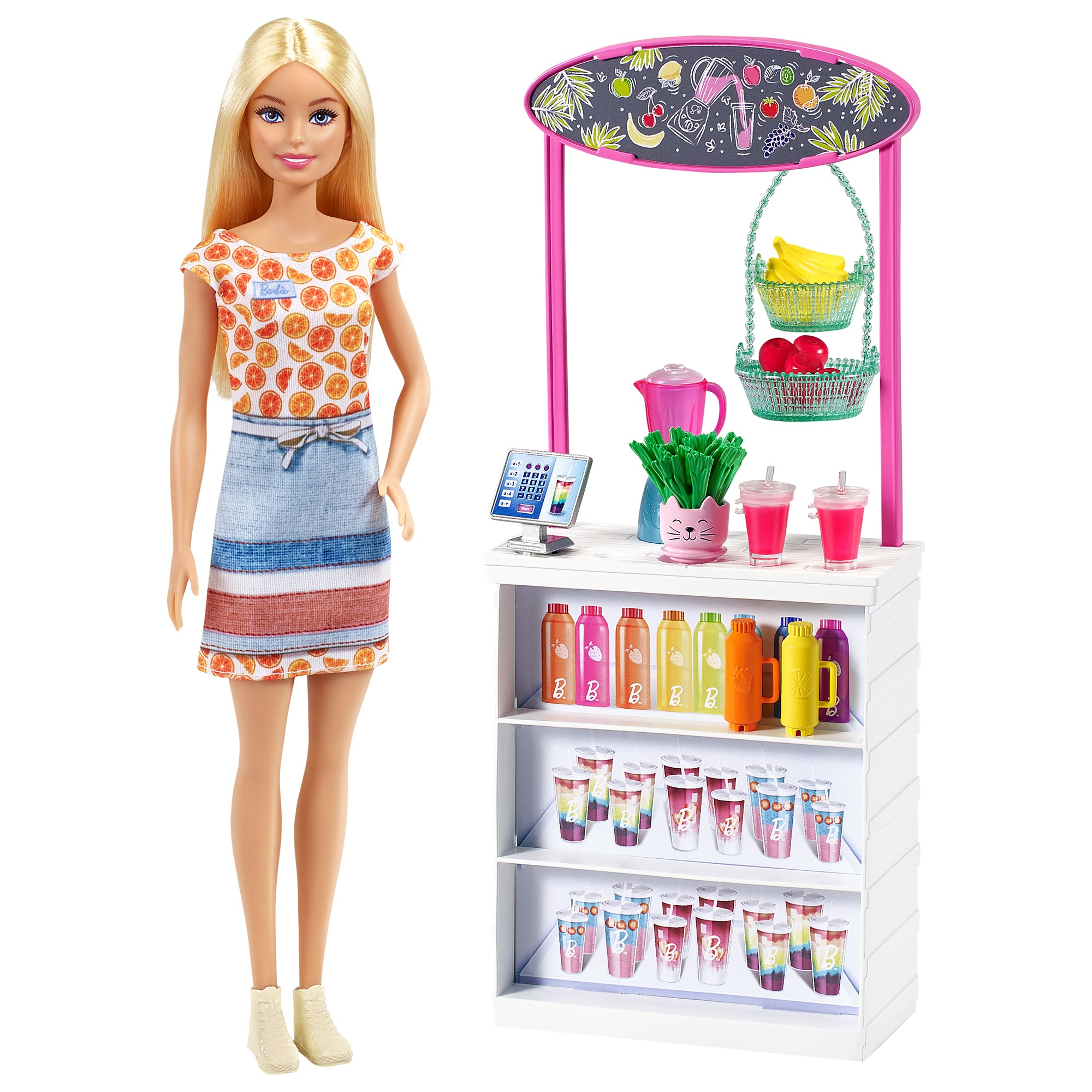 Barbie-Puppe neben einem Saftstand. Es gibt Saftflaschen, Getränke und Früchte.
