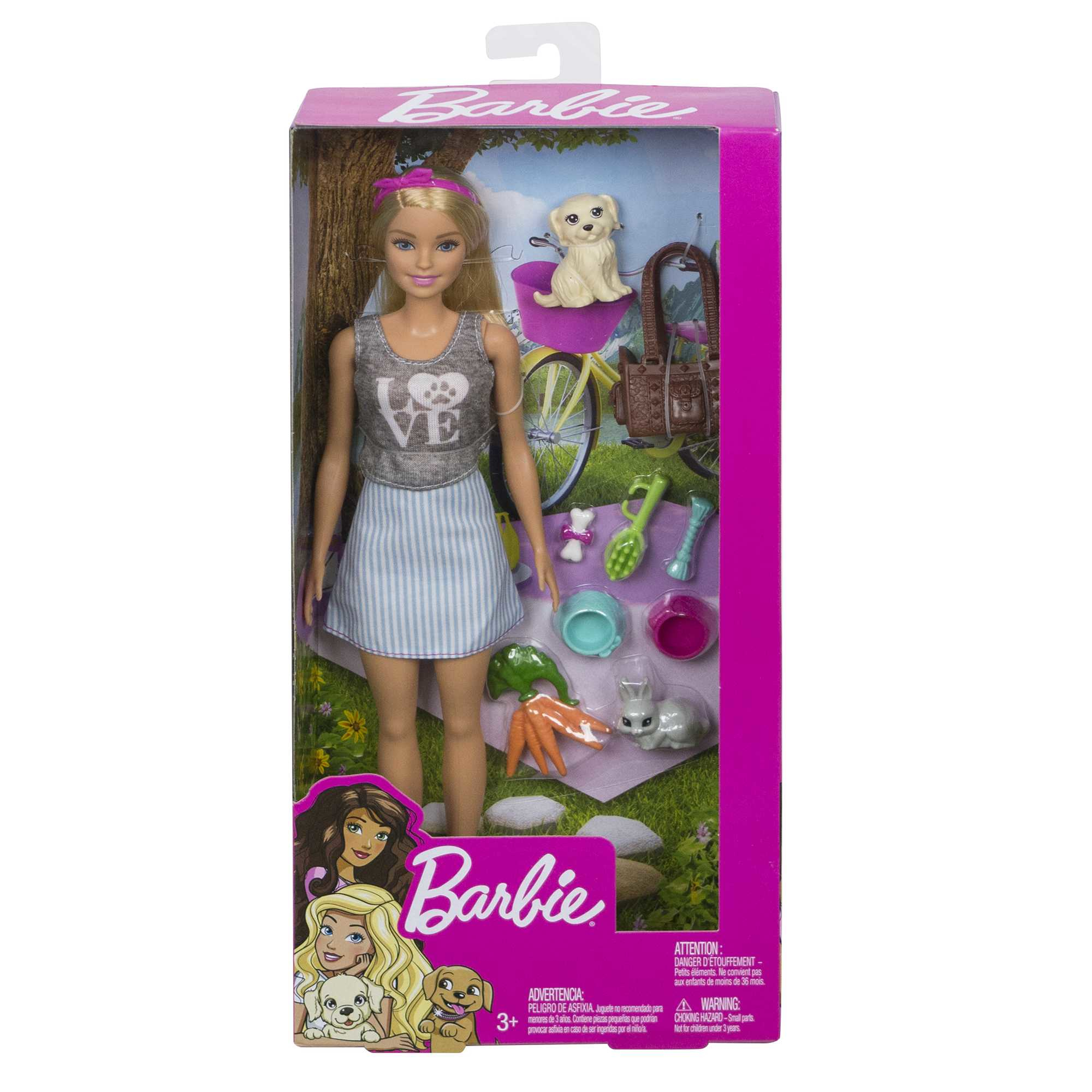 Barbie-Puppe in einer Box, mit Hundezubehör und einem Hund, mit rosa Hintergrund.