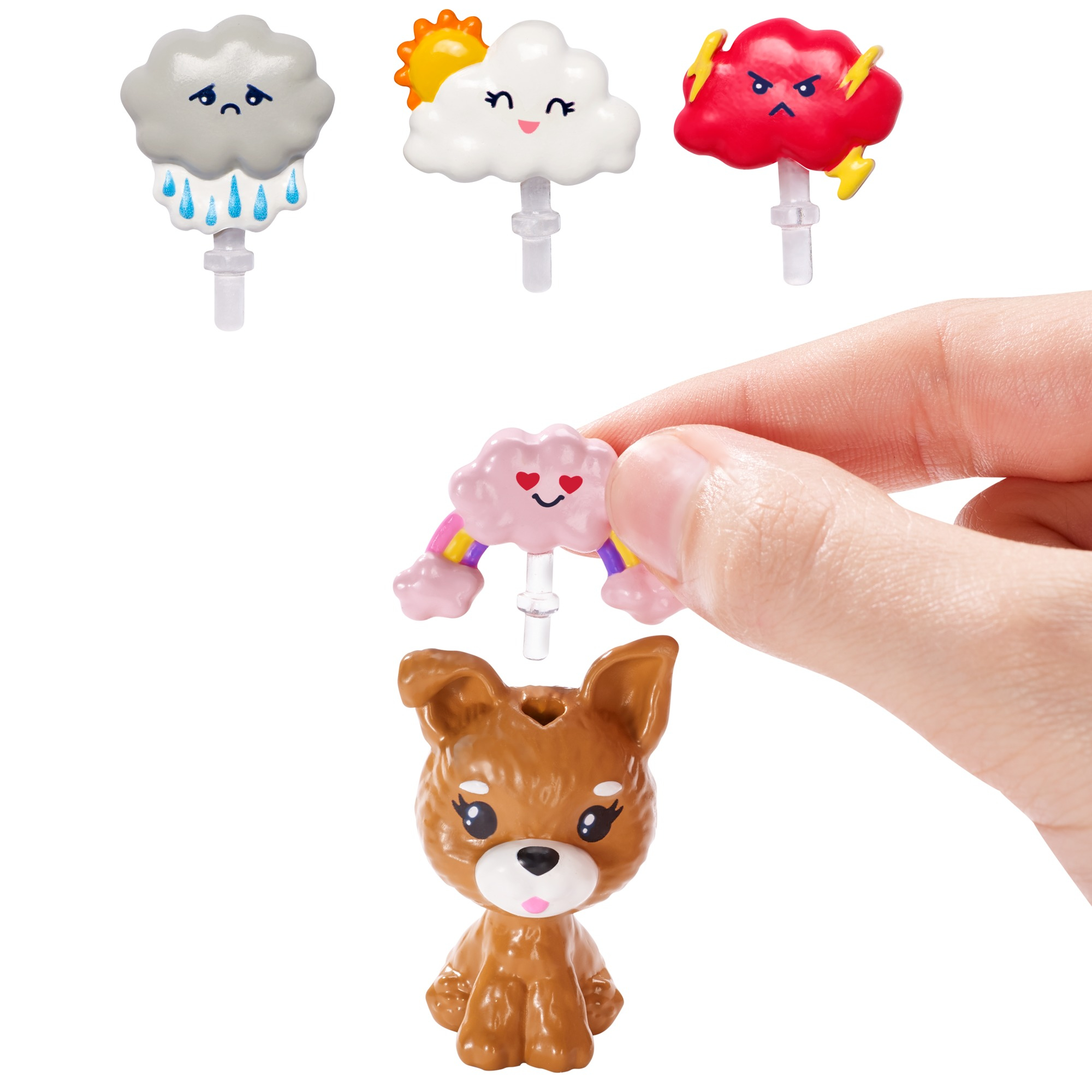 Eine Hand, die Spielzeug-Wetter-Icons hält, unten ein Hundespielzeug.