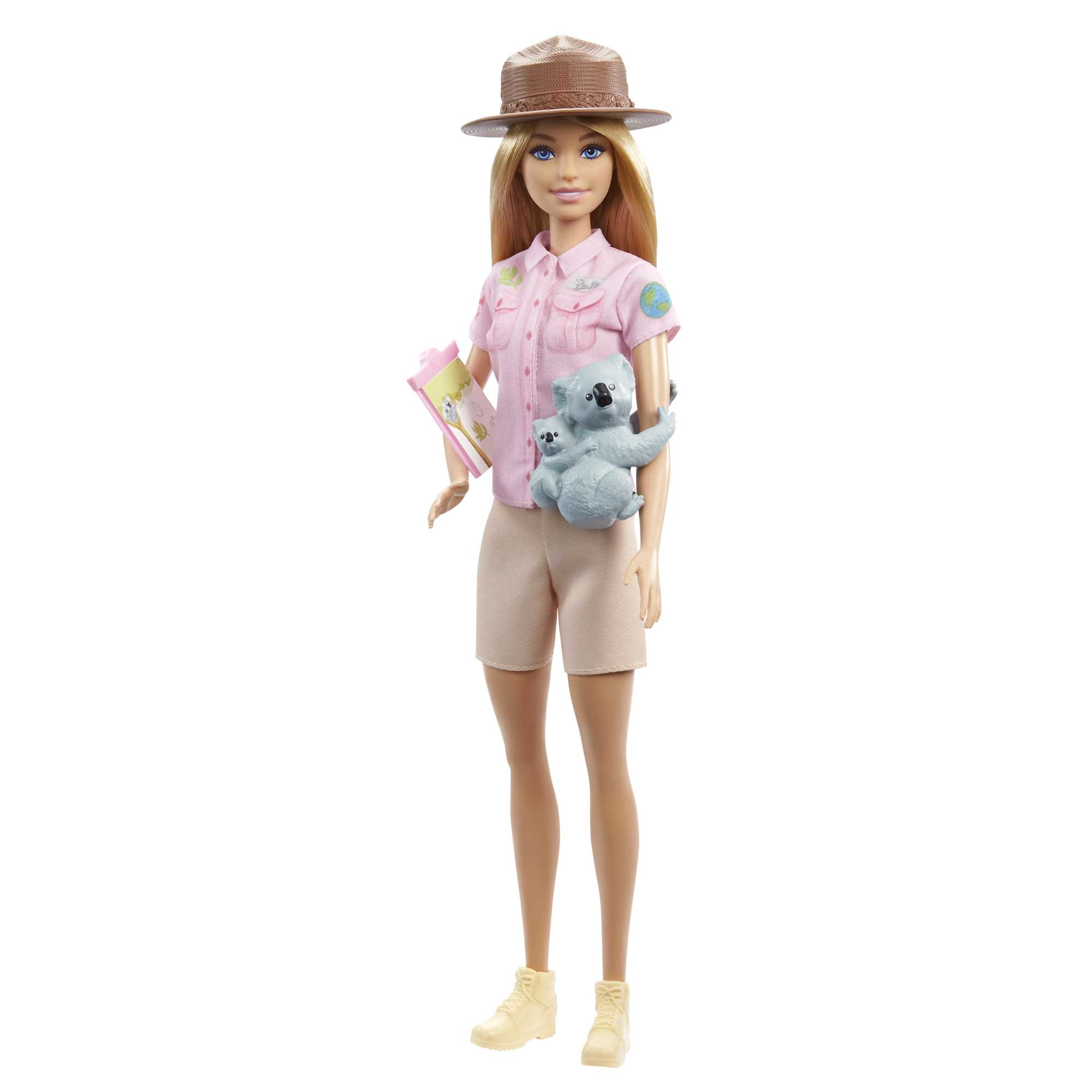 Barbie-Puppe mit Hut, die einen Koala und einen Klemmblock hält. Sie trägt ein rosa Oberteil und Shorts.